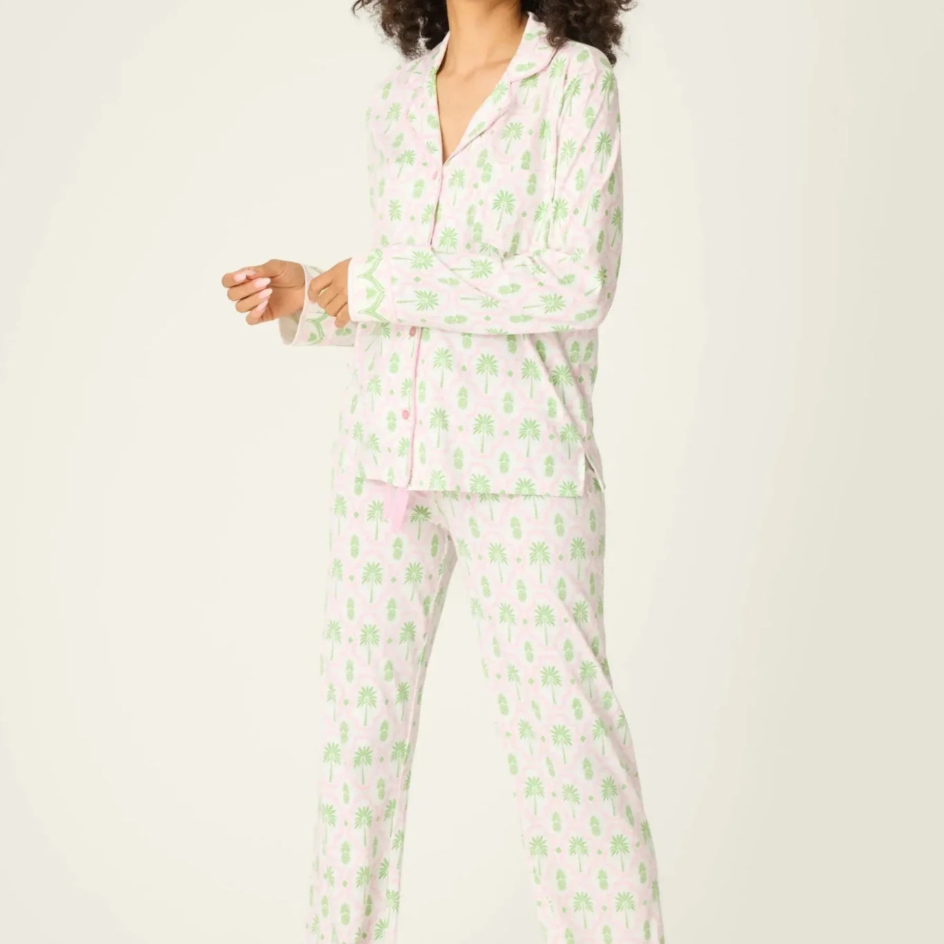 Playful Prints Cotton-Modal Long Sleeve Pajama Set by PJ Salvage displayed on a model with curly hair, in a playful pattern.
