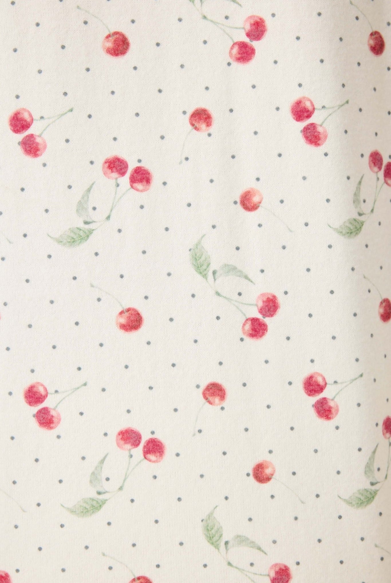 Polka Dot Cherries Peachy Jersey Pajama Set PJ Salvage fabric featuring red cherries on a polka dot background.