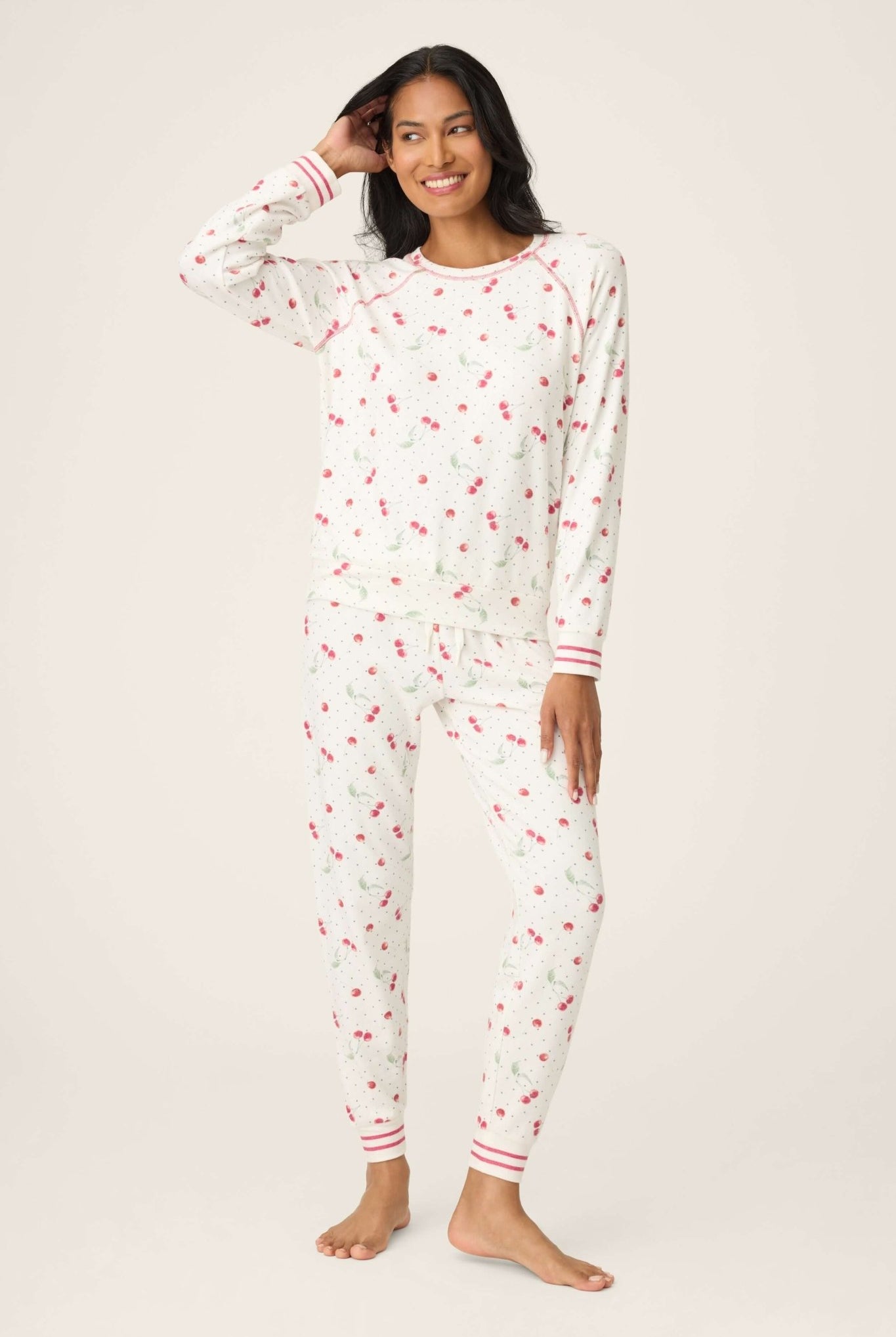 Polka Dot Cherries Peachy Jersey Pajama Set PJ Salvage modeled by a woman, featuring cherry and polka dot prints.