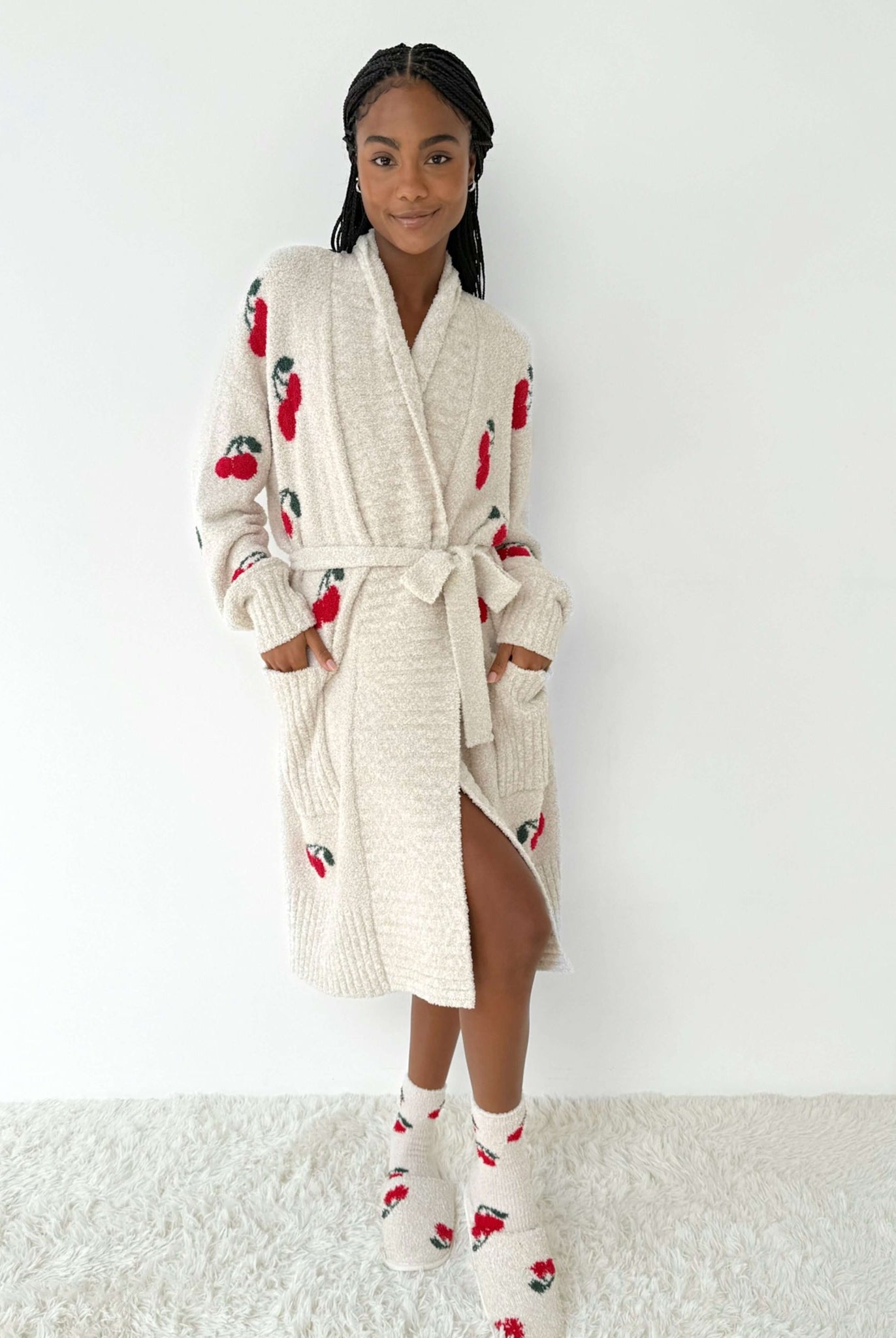 Model wearing the Pomona Fuzzy Yarn Robe Splendid, ultra-soft cozy loungewear with cherry patterns.