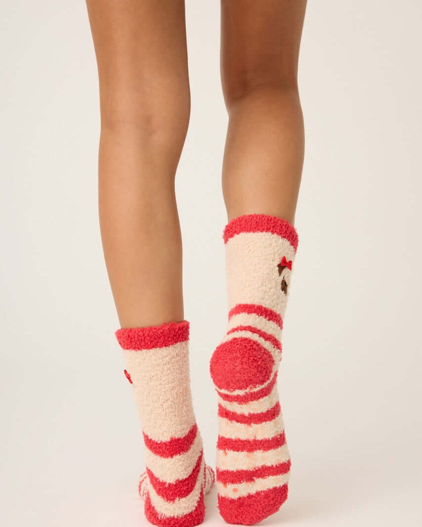 Pair of PJ Salvage Red & Tan Stripe Fuzzy Cozy Socks with the adorable pug embroidered with a bow detail. Anti-skid grippers visible on the bottom.