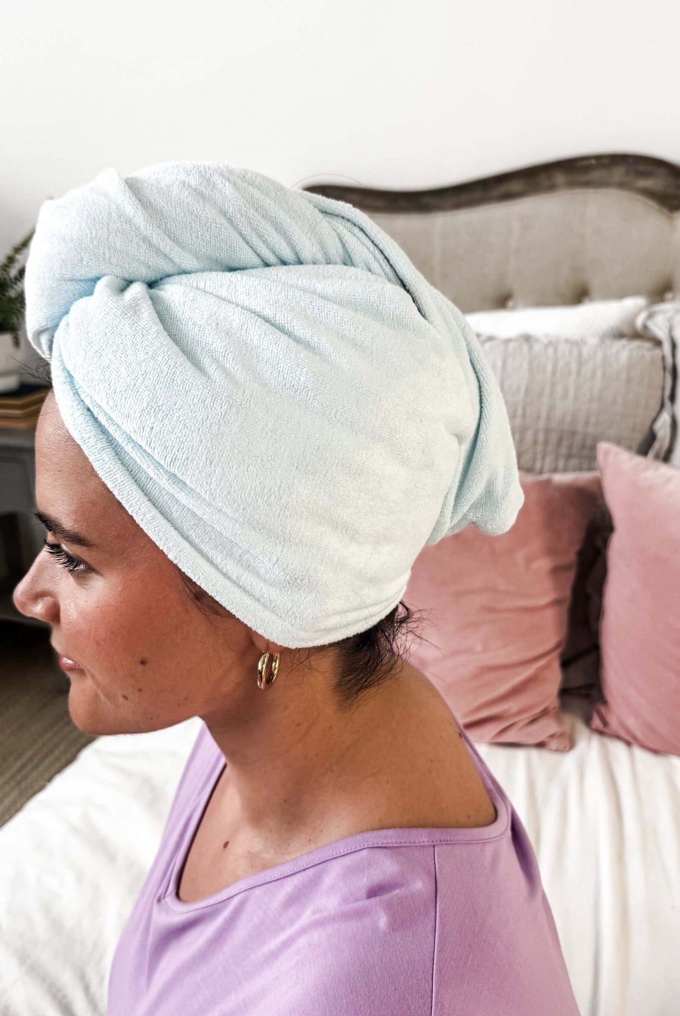 Remove It Quick Dry Microfiber Hair Towel Wrap on a woman, showcasing its quick-drying and anti-frizz features.
