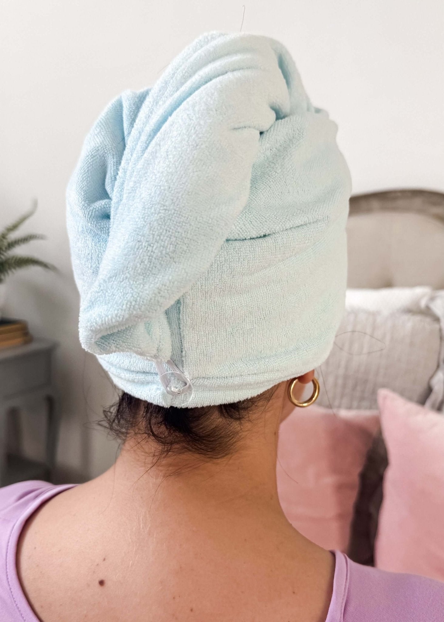 Remove It Quick Dry Microfiber Hair Towel Wrap in use, showcasing its quick-dry feature and sleek design.