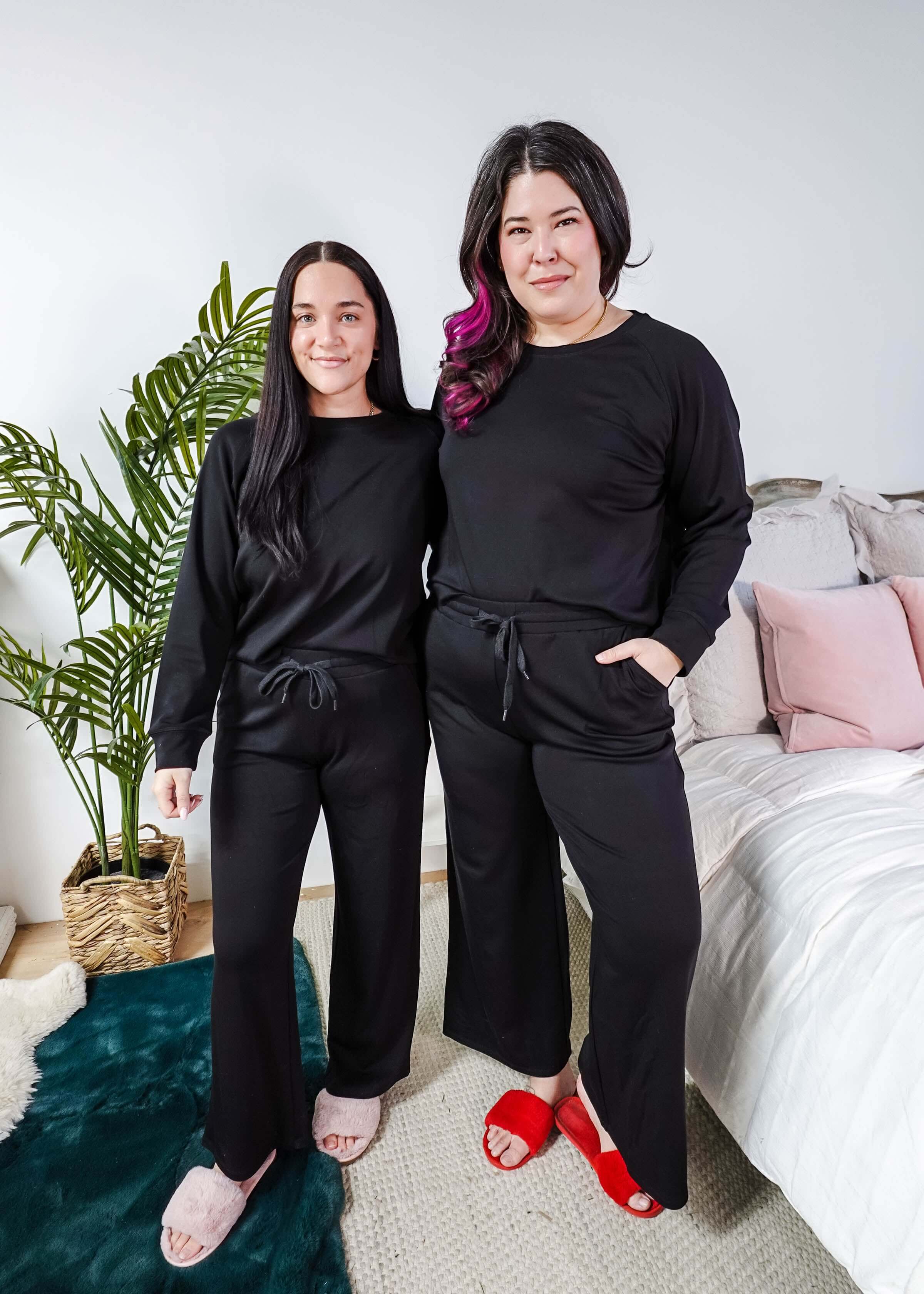 Black Long Sleeve Raw Edge Straight Pant Cloud Lounge Set worn by two women in a stylish home setting.