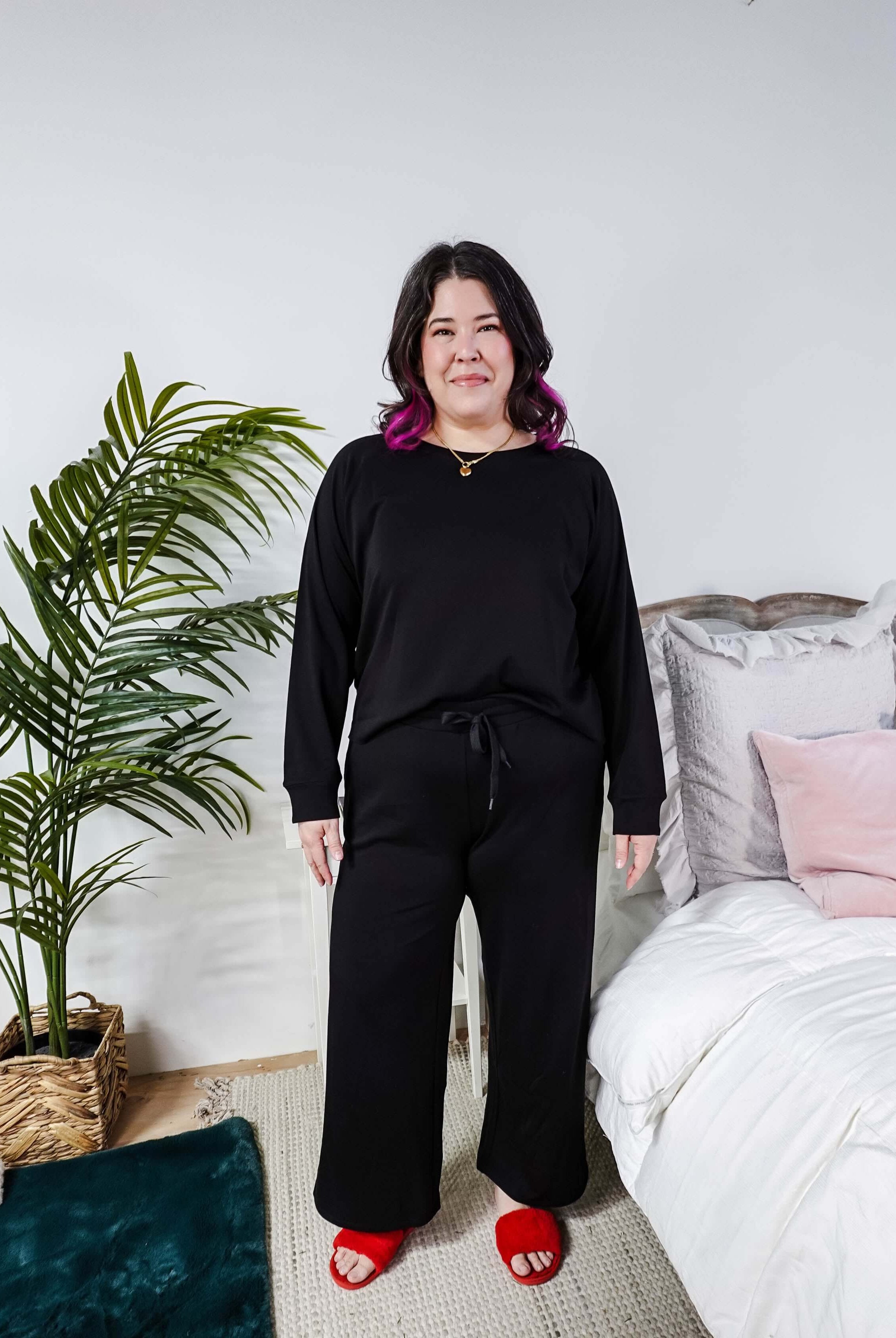 Black Long Sleeve Raw Edge Straight Pant Cloud Lounge Set worn by a model in a cozy home setting.