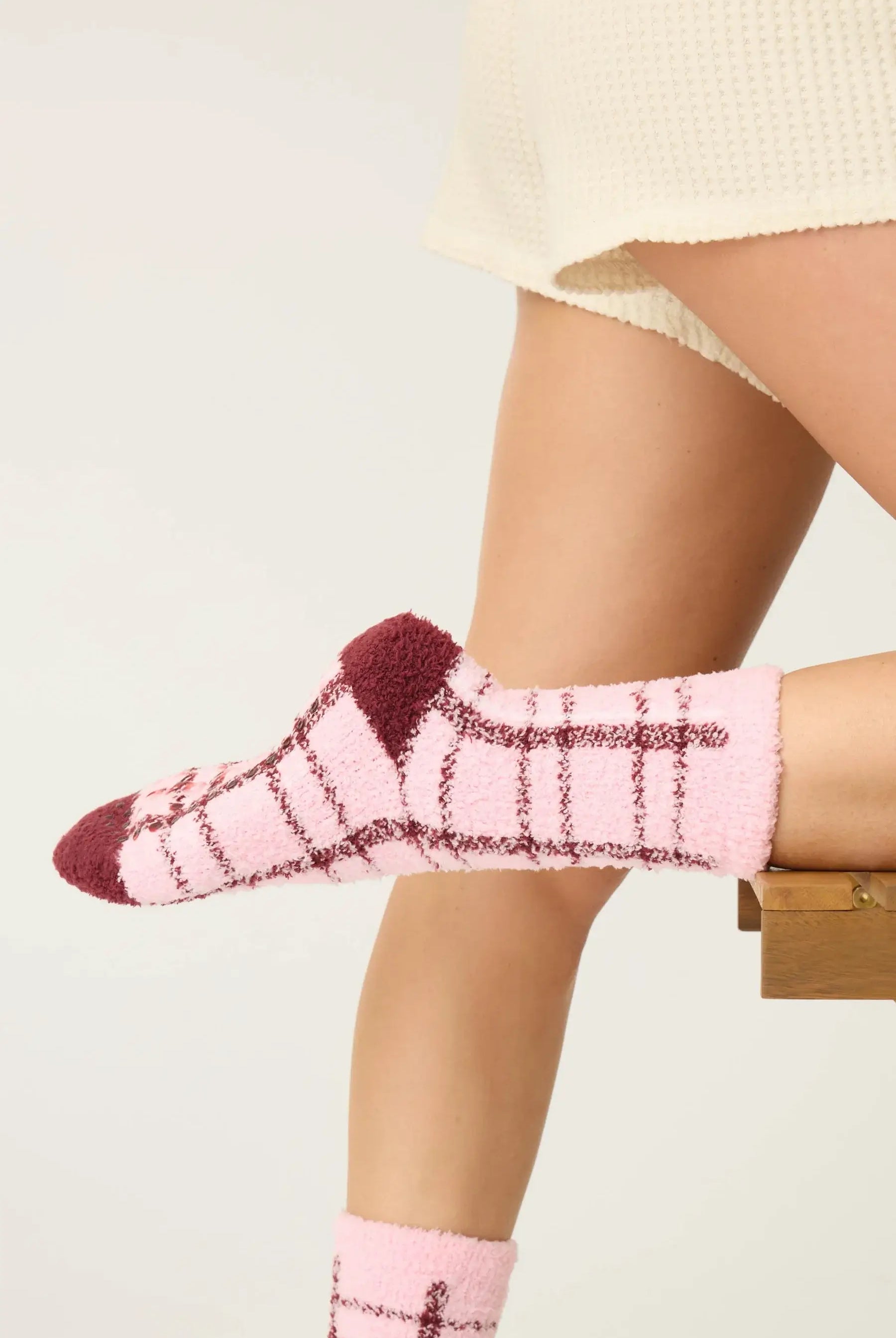 Pair of PJ Salvage Pink & Burgundy Plaid Fuzzy Crew Socks showing the cheerful pattern and plush texture.