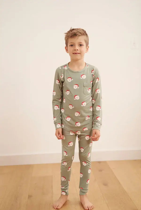 Santa Kids Classic Bamboo Jogger PJ Set featuring a child in festive Santa print pajamas.