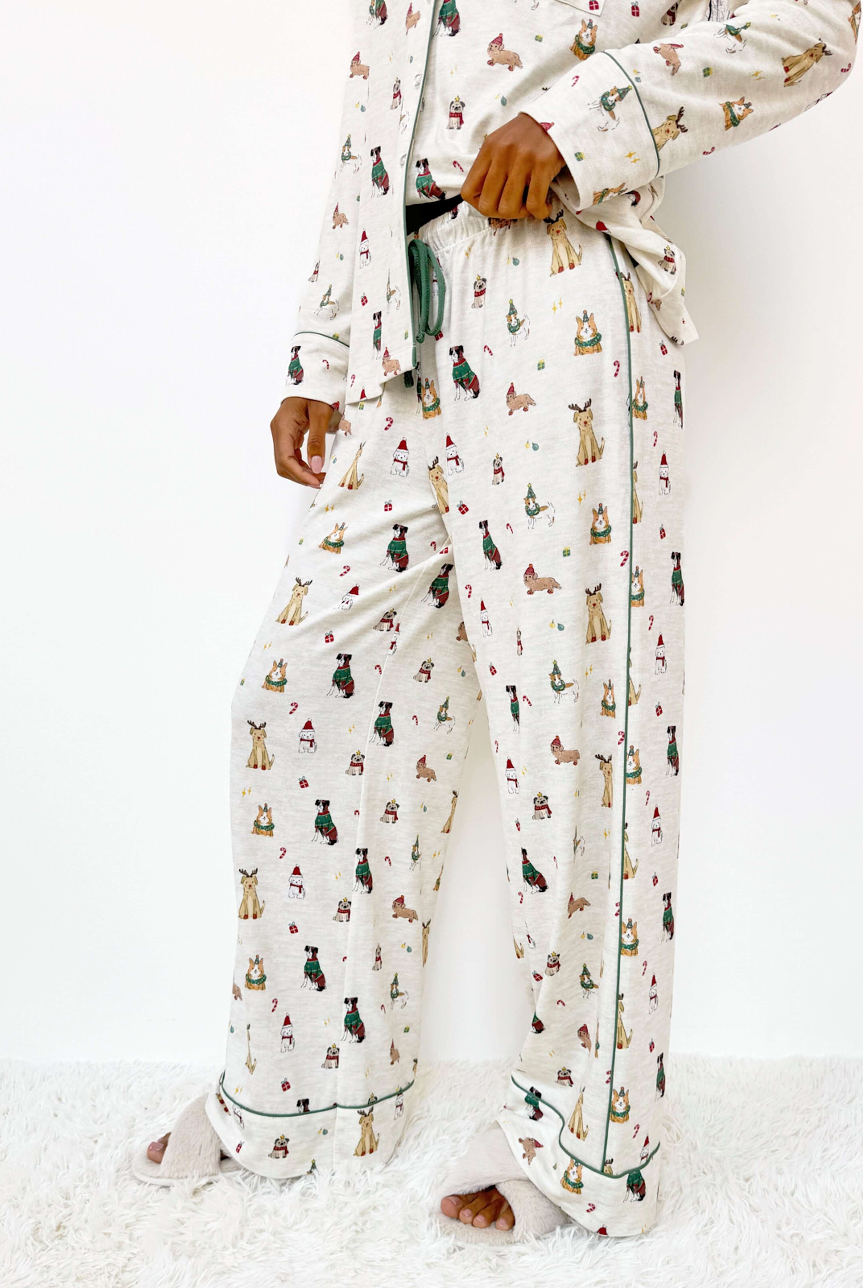 Flora Pillowsoft Sleep Set Splendid featuring silky soft button-down pajamas with playful festive dog prints. Showing the wide leg pant and Christmas Puppy print