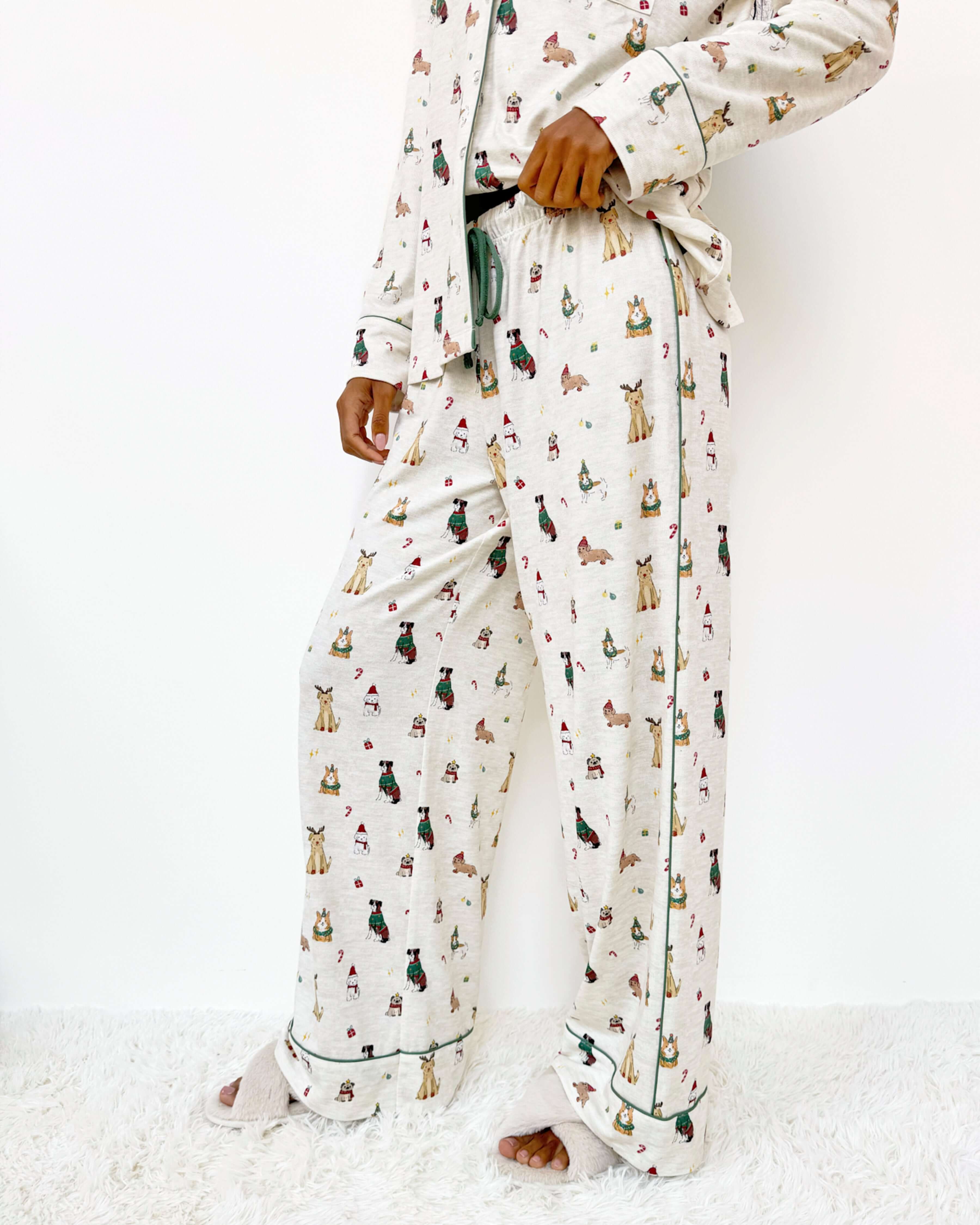 Flora Pillowsoft Sleep Set Splendid featuring silky soft button-down pajamas with playful festive dog prints. Showing the wide leg pant and Christmas Puppy print