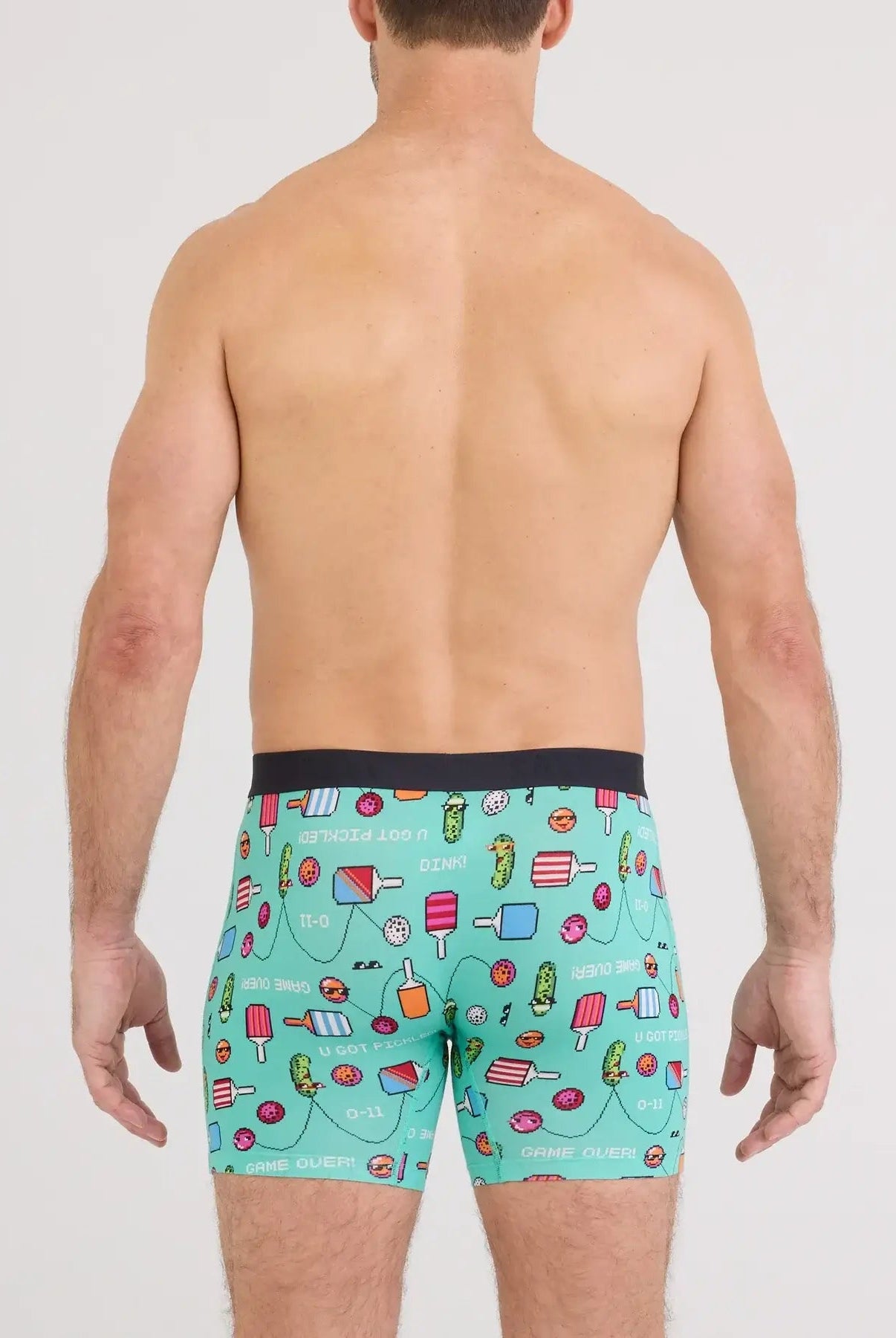 Back view of a man wearing Vibe Xtra Soft Comfort Boxer Brief with colorful food-themed prints.