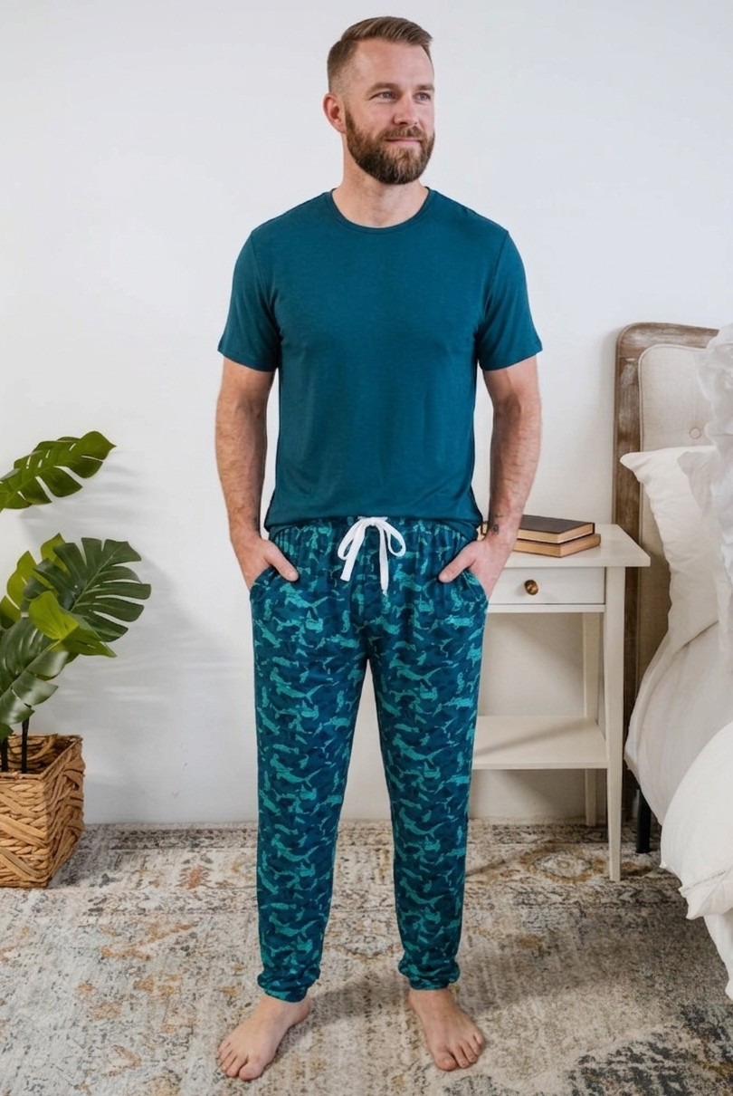 Shark Camo Blue Printed Jogger Sleep Pant in Bamboo for Men by Bob's Sleepwear Co - Cloud Nine Pajamas Worn by Model in Bedroom Setting