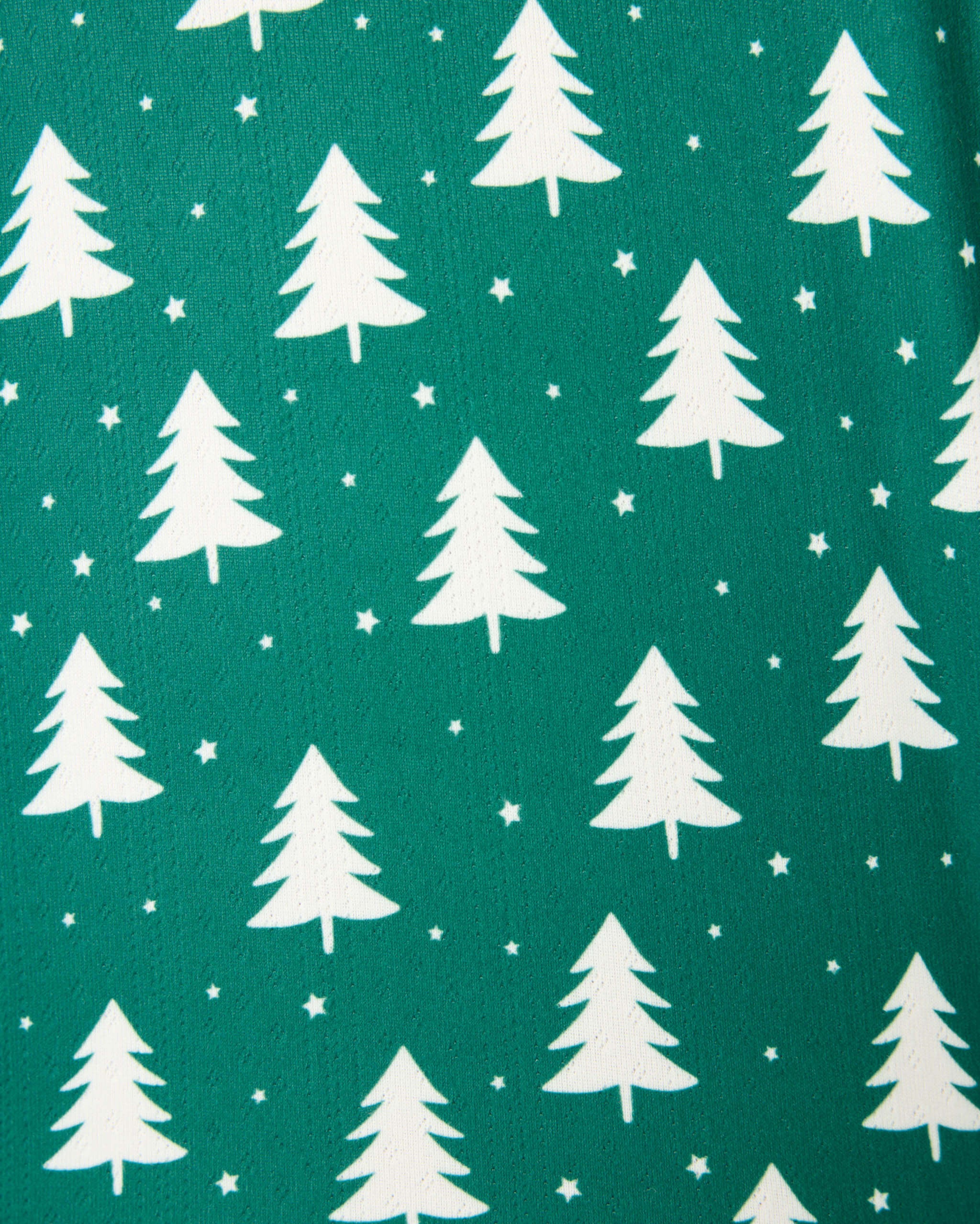 Pattern of white Christmas trees on a forest green background, perfect for the Silent Night PJ Set.
