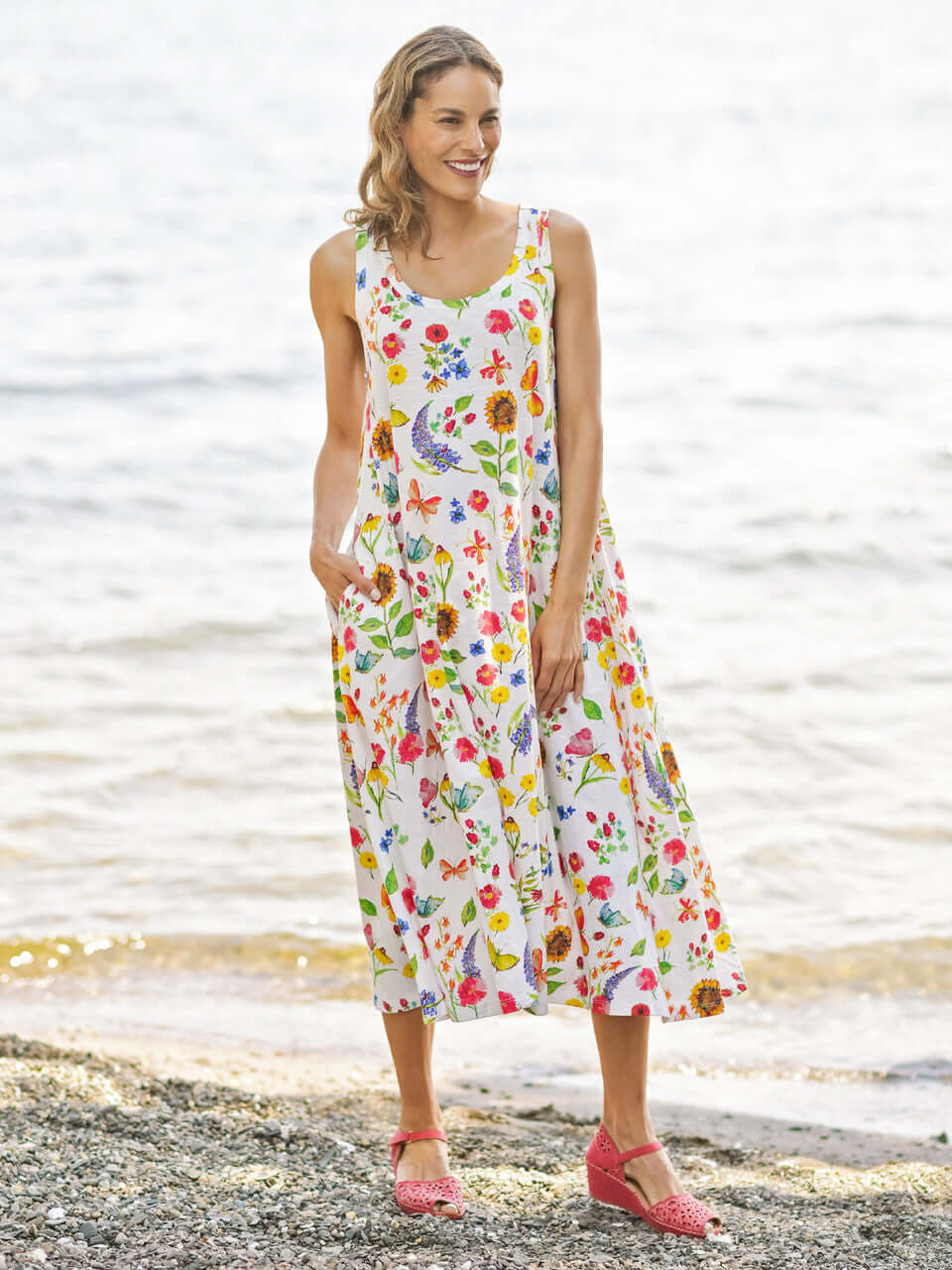 April Cornell Sister Garden Cotton Midi Floral Dress - A line style dress with pockets. Shown on a model in full length against a beach background