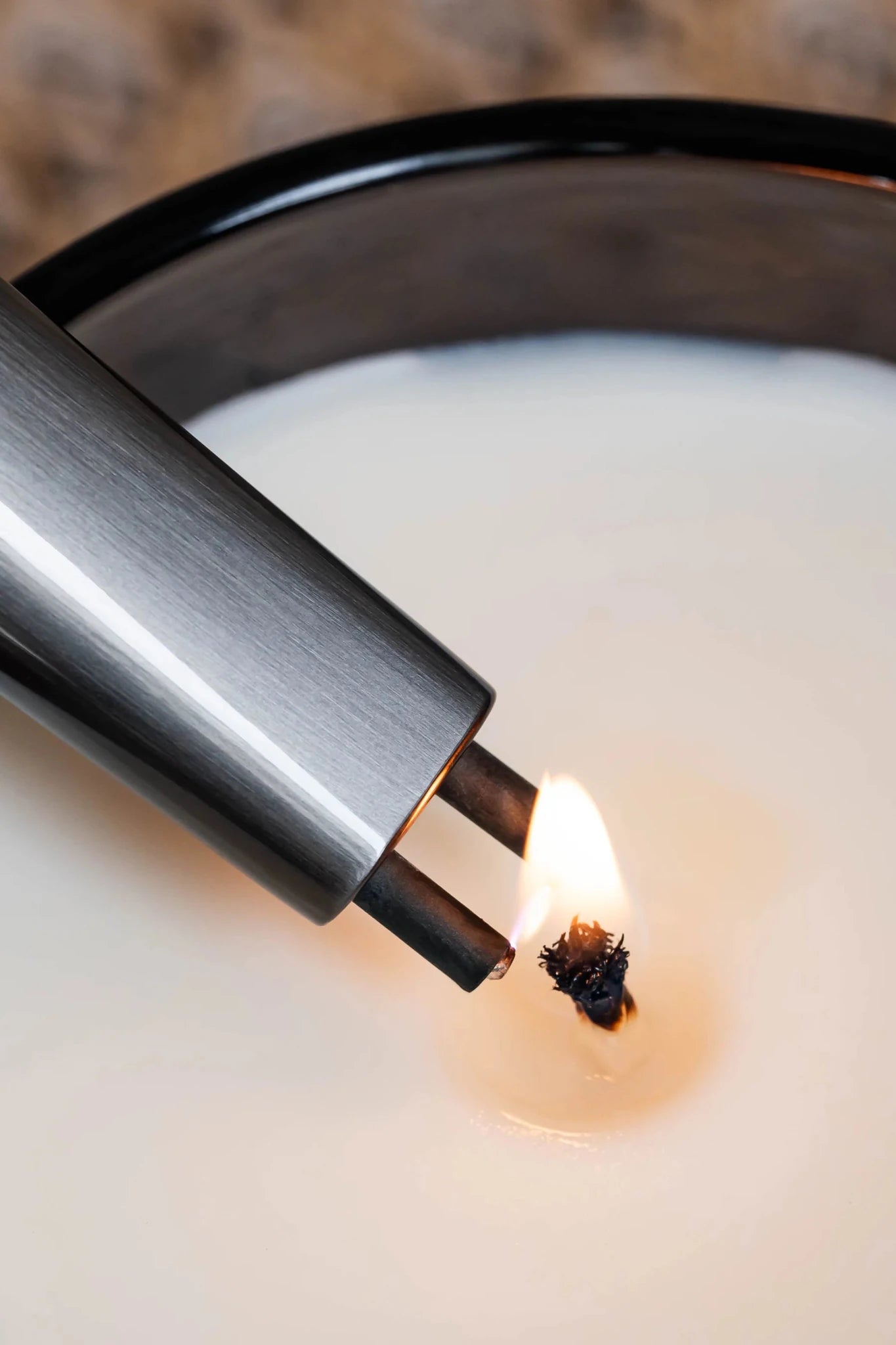 all-groups Sizzle Sleek Rechargeable Arc Lighter shown lighting a candle