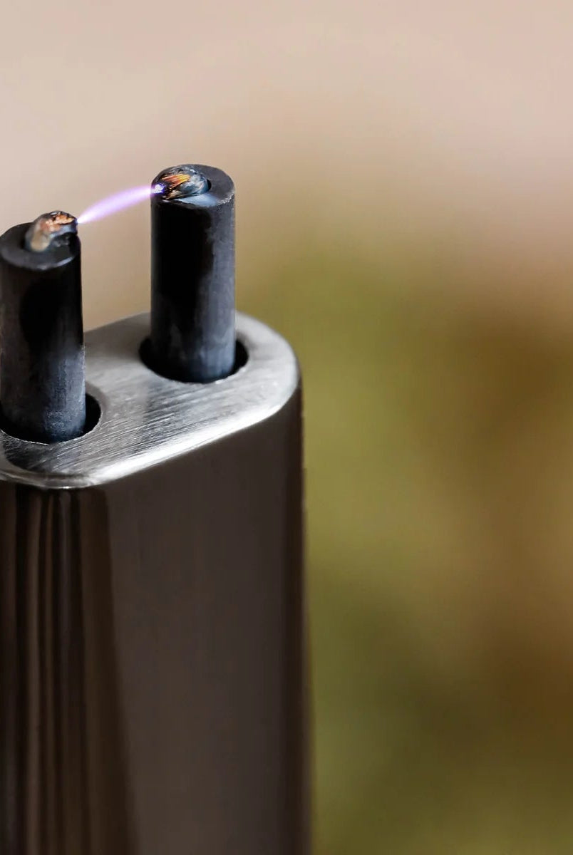 all-groups Sizzle Sleek Rechargeable Arc Lighter showing lit arc