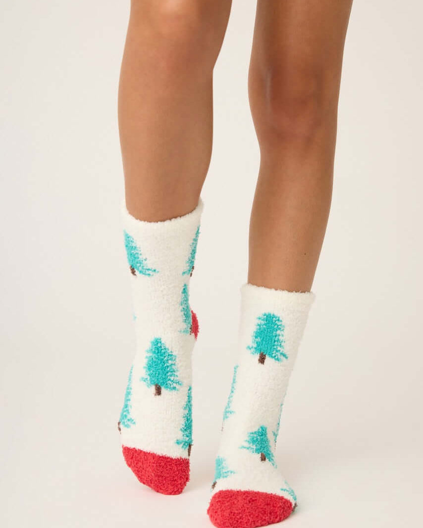 Sleigh All Day Socks with tree print and red grippers, perfect for cozy winter wear. PJ Salvage's fuzzy socks.