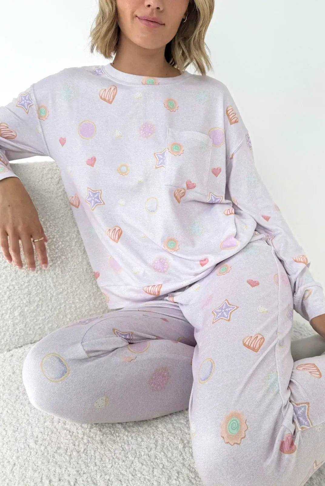 Model wearing Splendid Holiday Sugar Cookie Marna Pillowsoft PJ Set featuring playful holiday-themed prints.