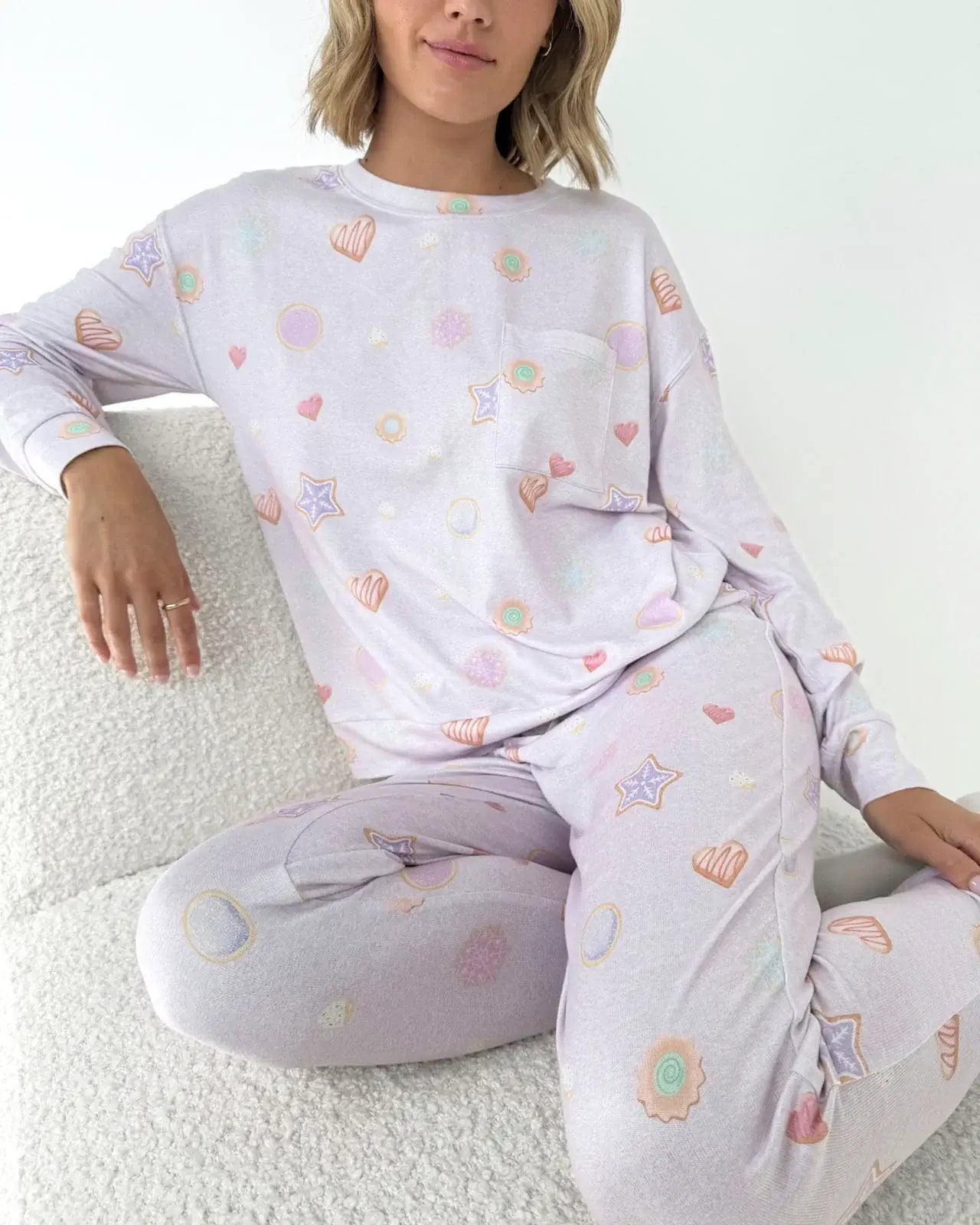 Model wearing Splendid Holiday Sugar Cookie Marna Pillowsoft PJ Set featuring playful holiday-themed prints.