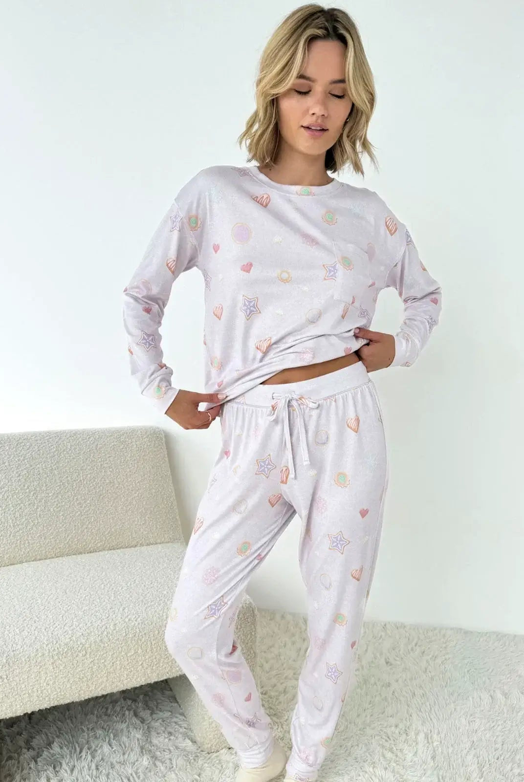 Woman wearing Splendid Holiday Sugar Cookie Marna Pillowsoft PJ Set, featuring festive prints for cozy holiday lounging.