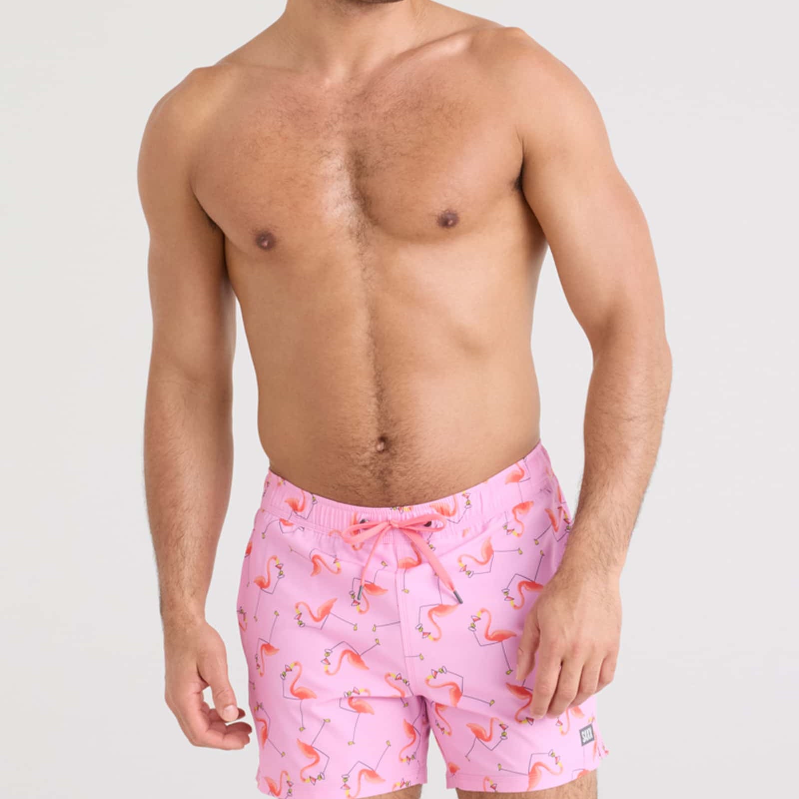 Oh Buoy 2N1 Volley Swim Short featuring a fun flamingo print on a model by SAXX.