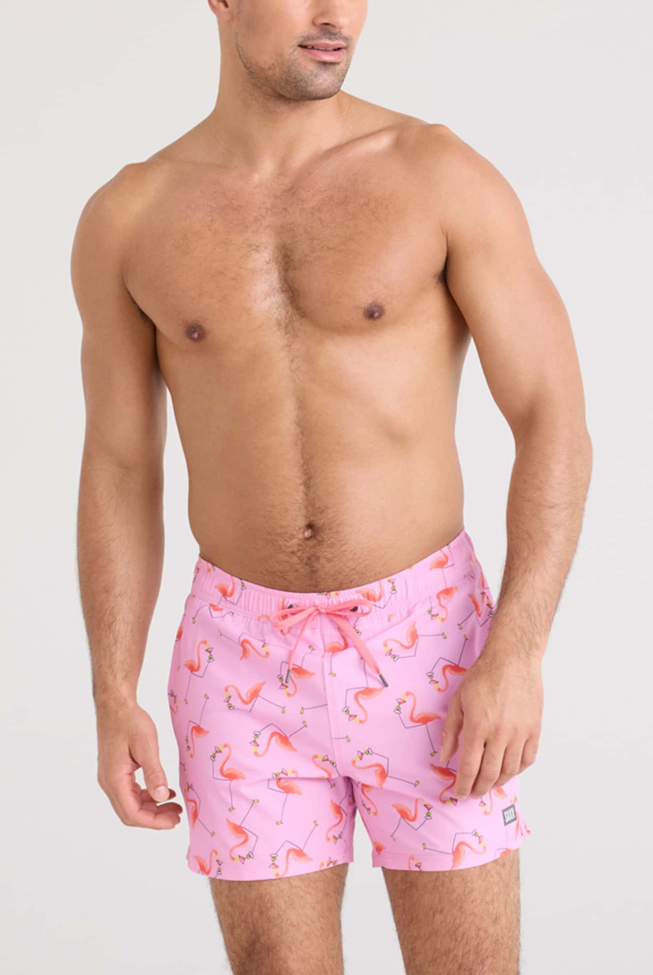 Oh Buoy 2N1 Volley Swim Short featuring a fun flamingo print on a model by SAXX.