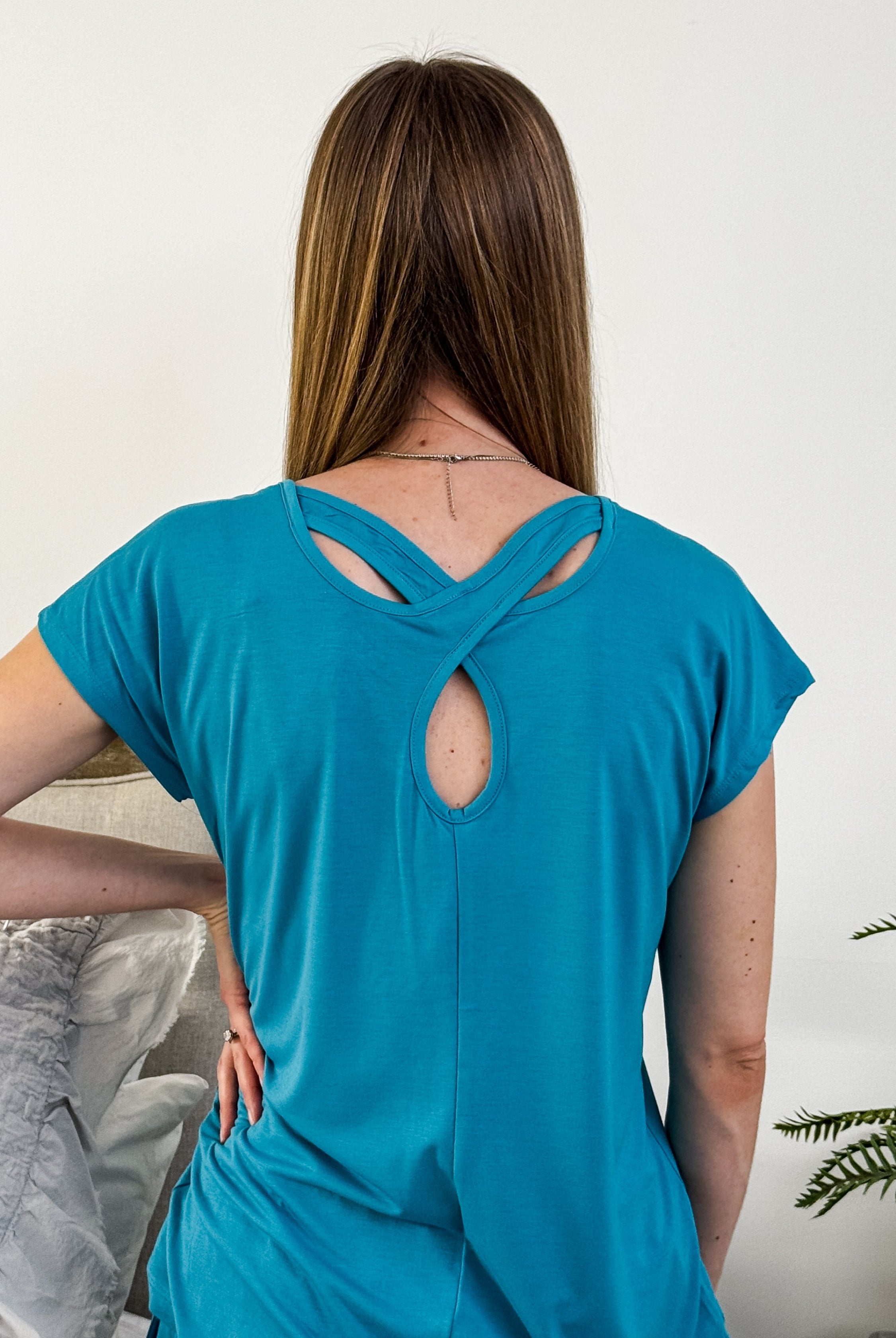 Close-up of the aqua cooling rayon/poly/spandex blend fabric, showing the soft drape.