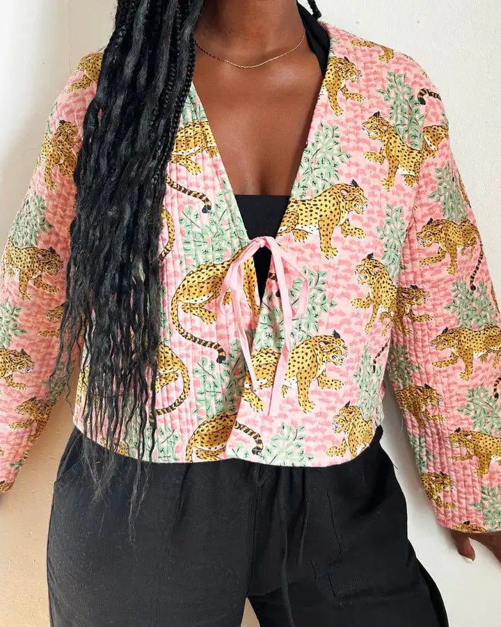 Quited Handmade Clara Jacket in Pink Leopard by French Toast Handmade. Worn by model standing against a light background.