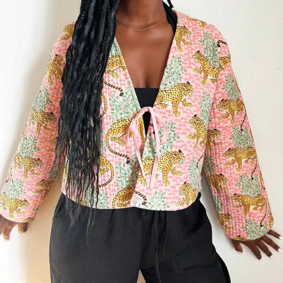 Quited Handmade Clara Jacket in Pink Leopard by French Toast Handmade. Worn by model standing against a light background.