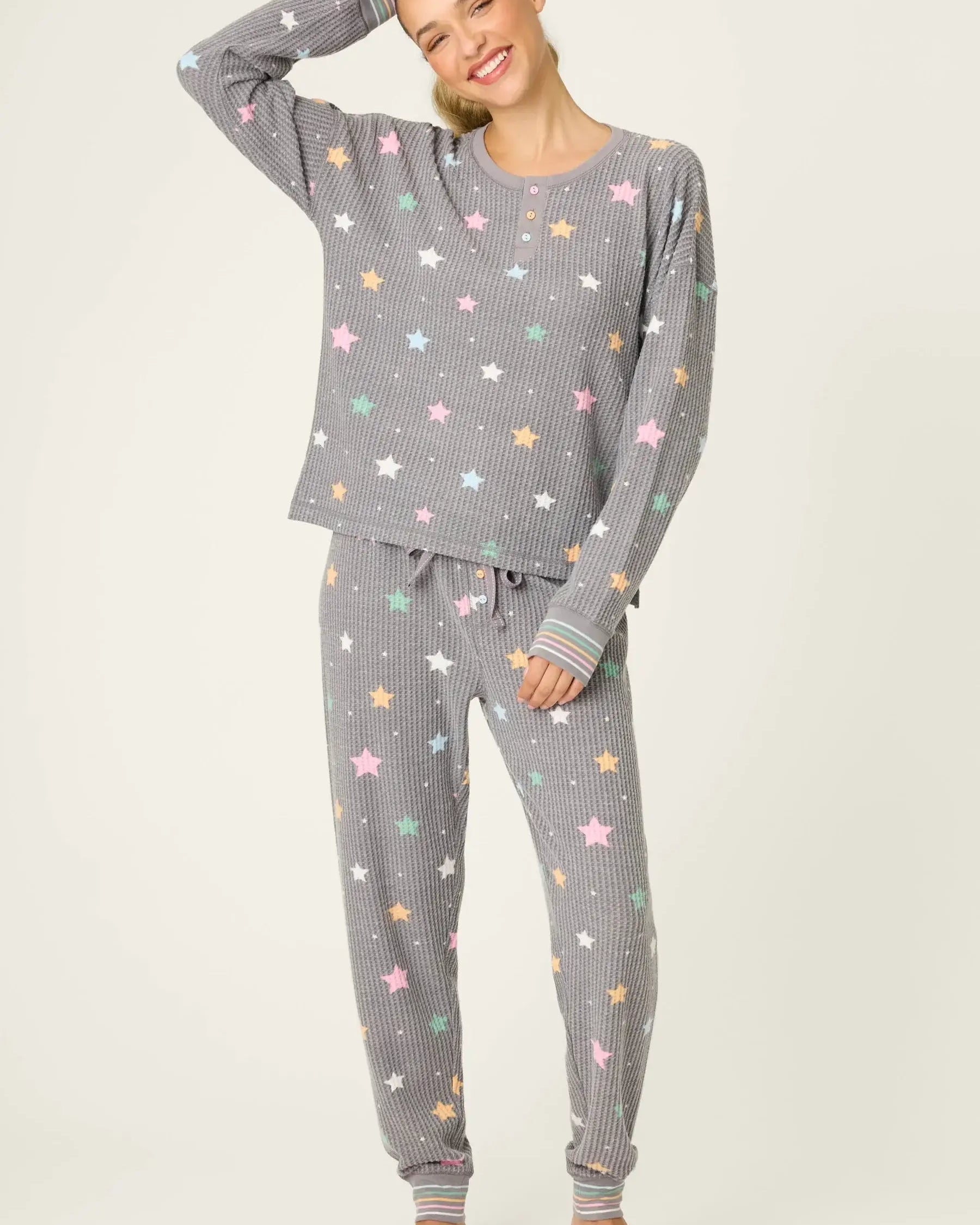 women's thermal waffle pj set with star print and charcoal grey background. Long sleeve top with buttons and Jogger bottoms by PJ Salvage