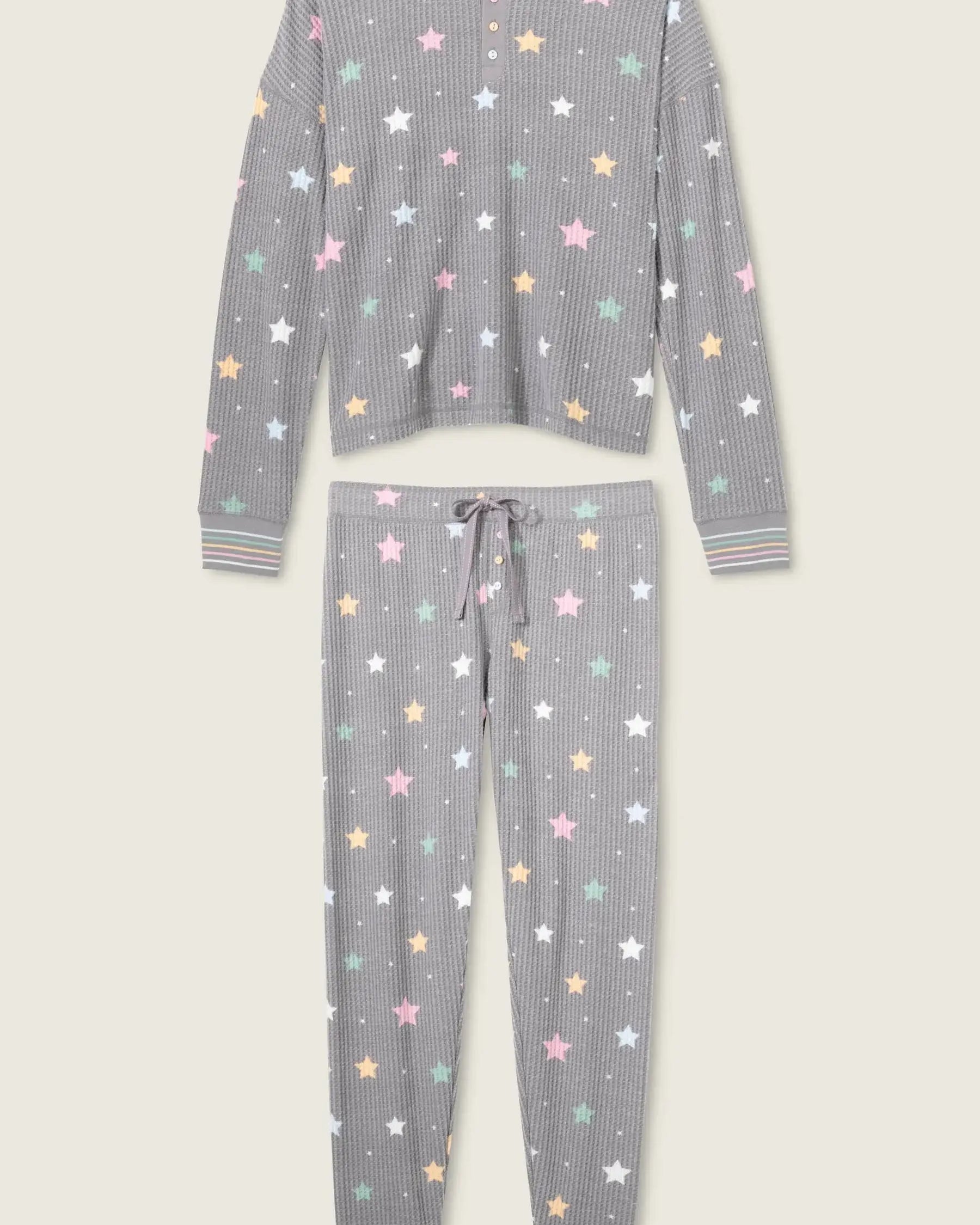 women's thermal waffle pj set with star print and charcoal grey background. Long sleeve top with buttons and Jogger bottoms by PJ Salvage