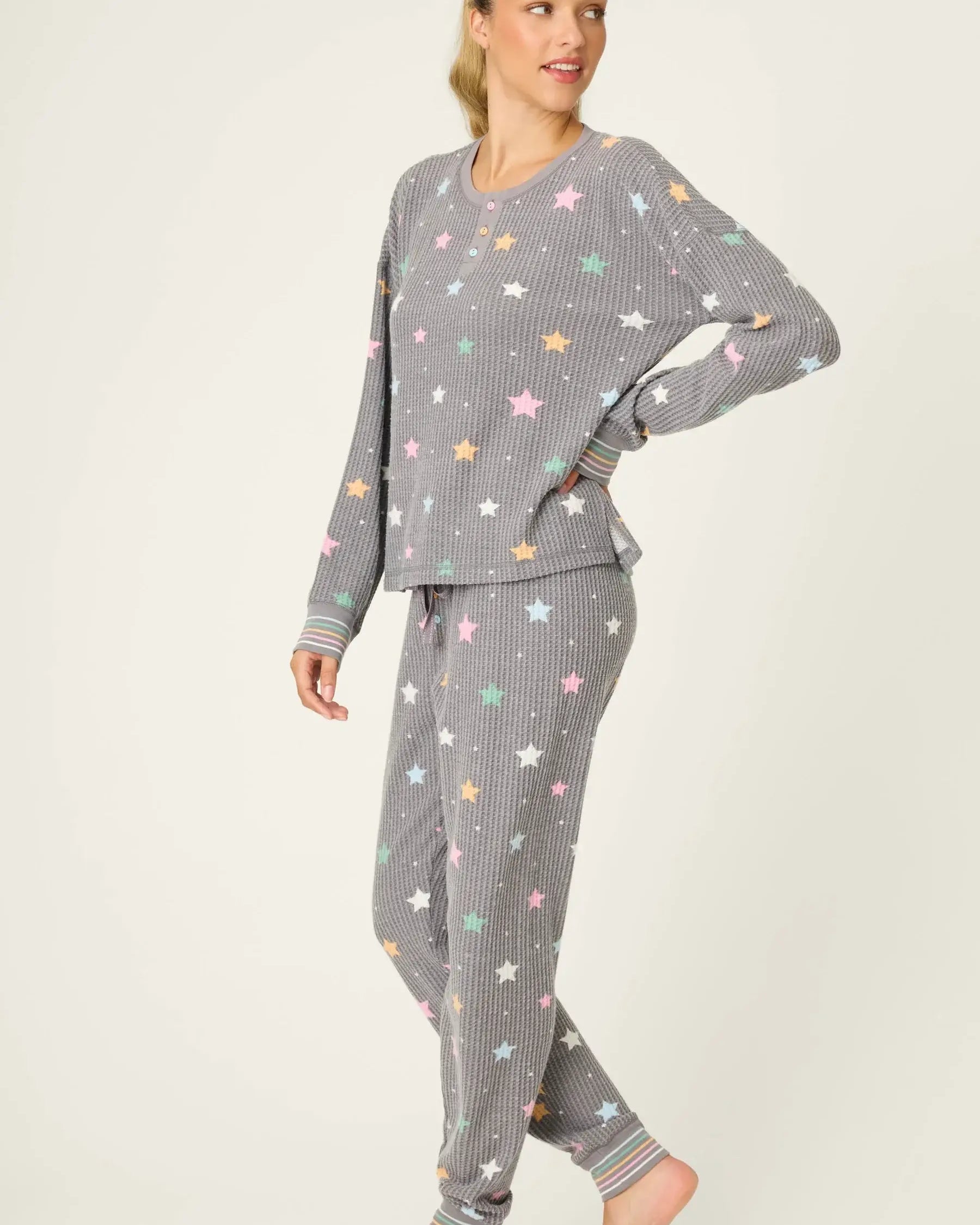 women's thermal waffle pj set with star print and charcoal grey background. Long sleeve top with buttons and Jogger bottoms by PJ Salvage