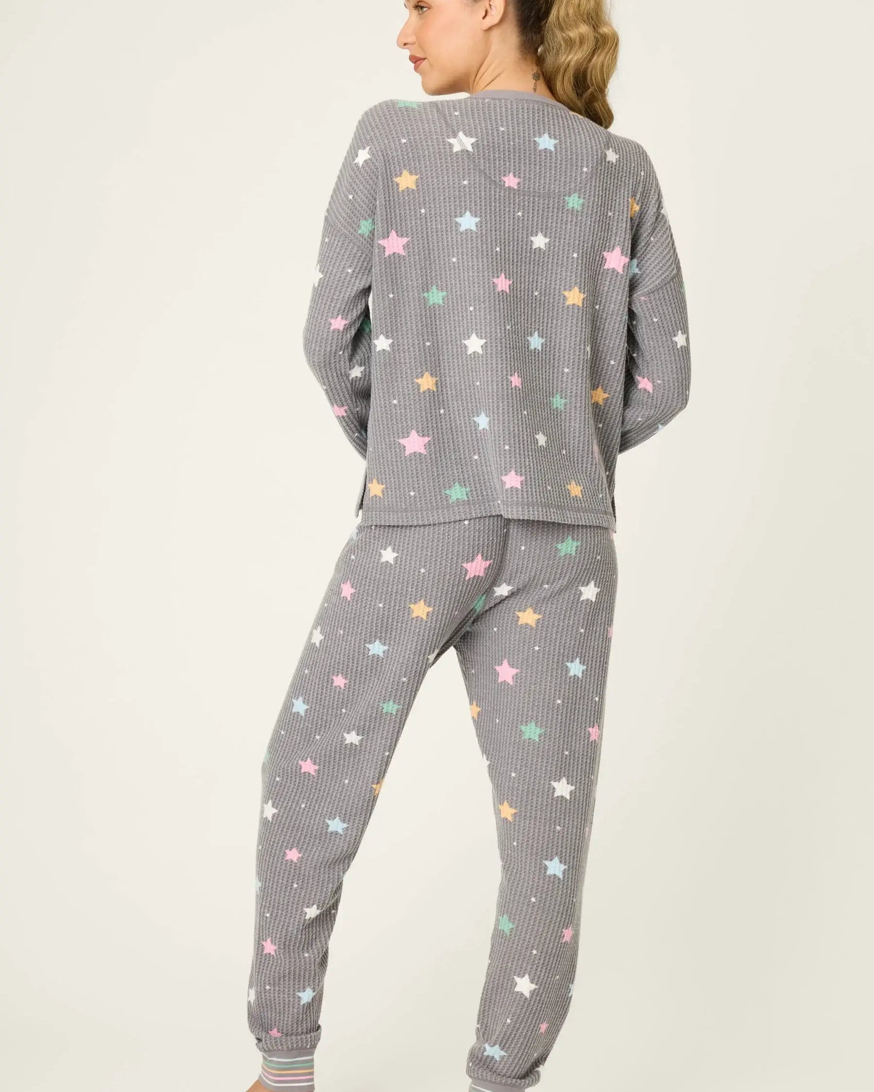 women's thermal waffle pj set with star print and charcoal grey background. Long sleeve top with buttons and Jogger bottoms by PJ Salvage