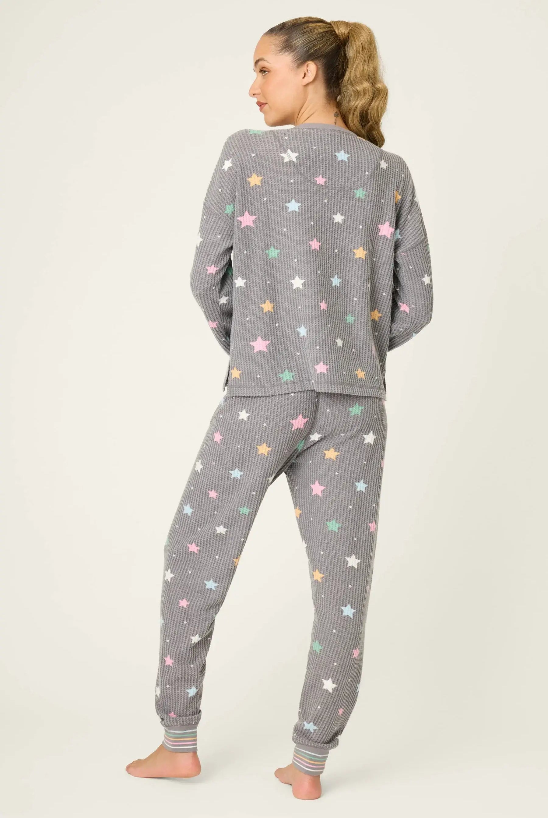 women's thermal waffle pj set with star print and charcoal grey background. Long sleeve top with buttons and Jogger bottoms by PJ Salvage