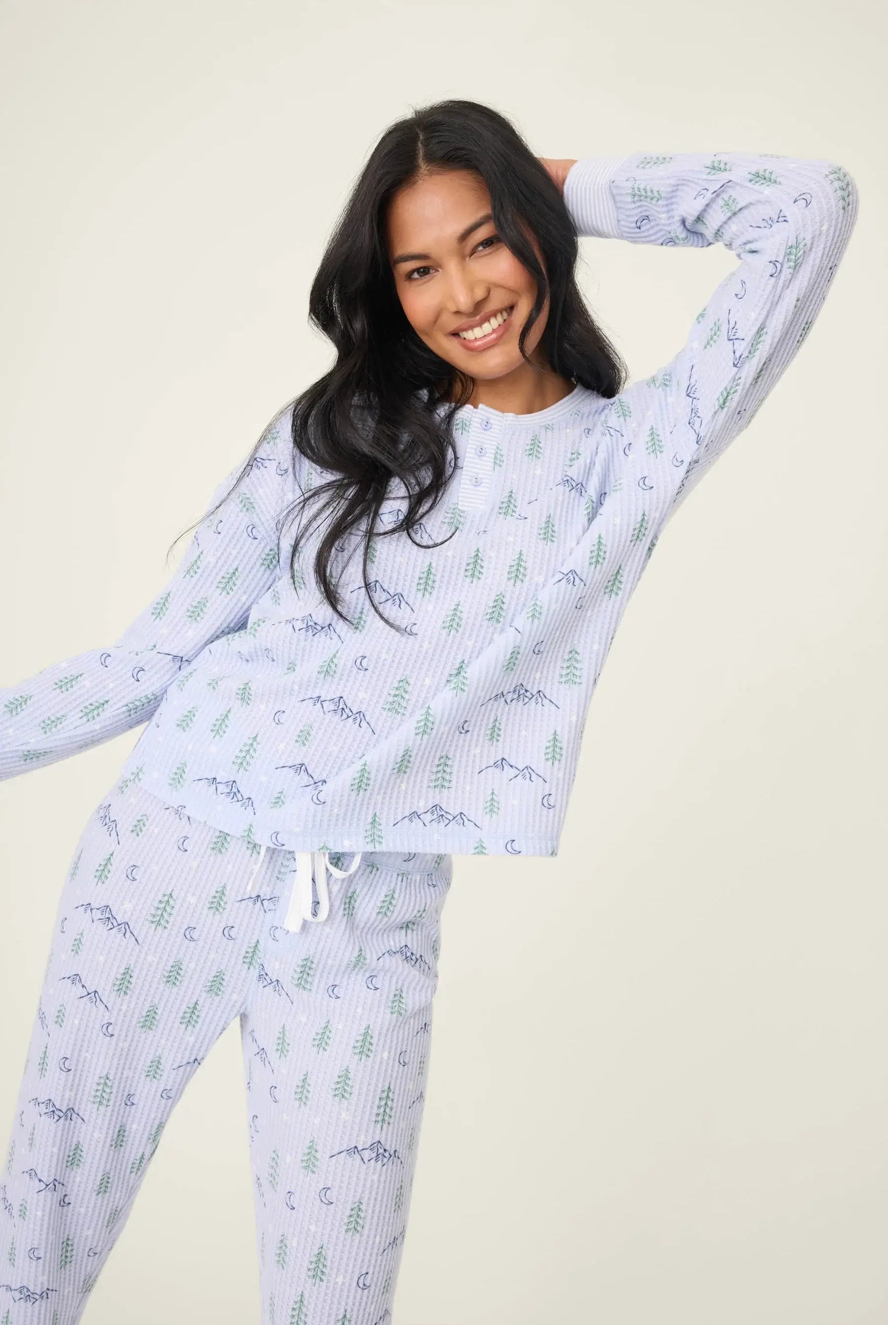 Model wearing the Mountain Dreams Thermal PJ Set with long sleeves and joggers in a cozy, winter-themed design.