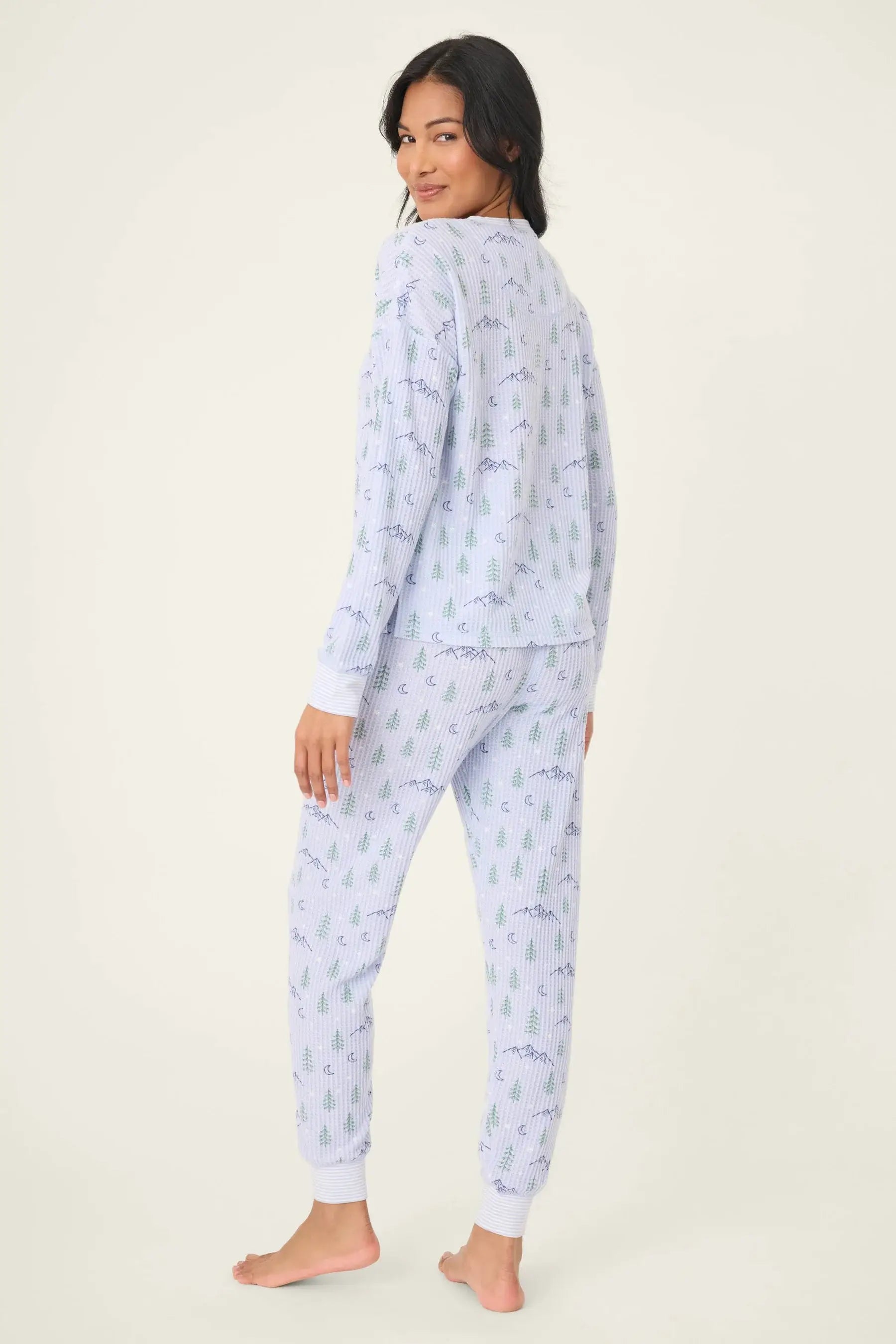 Model wearing Mountain Dreams Thermal PJ Set in soft fabric, showcasing long sleeve top and jogger bottoms.