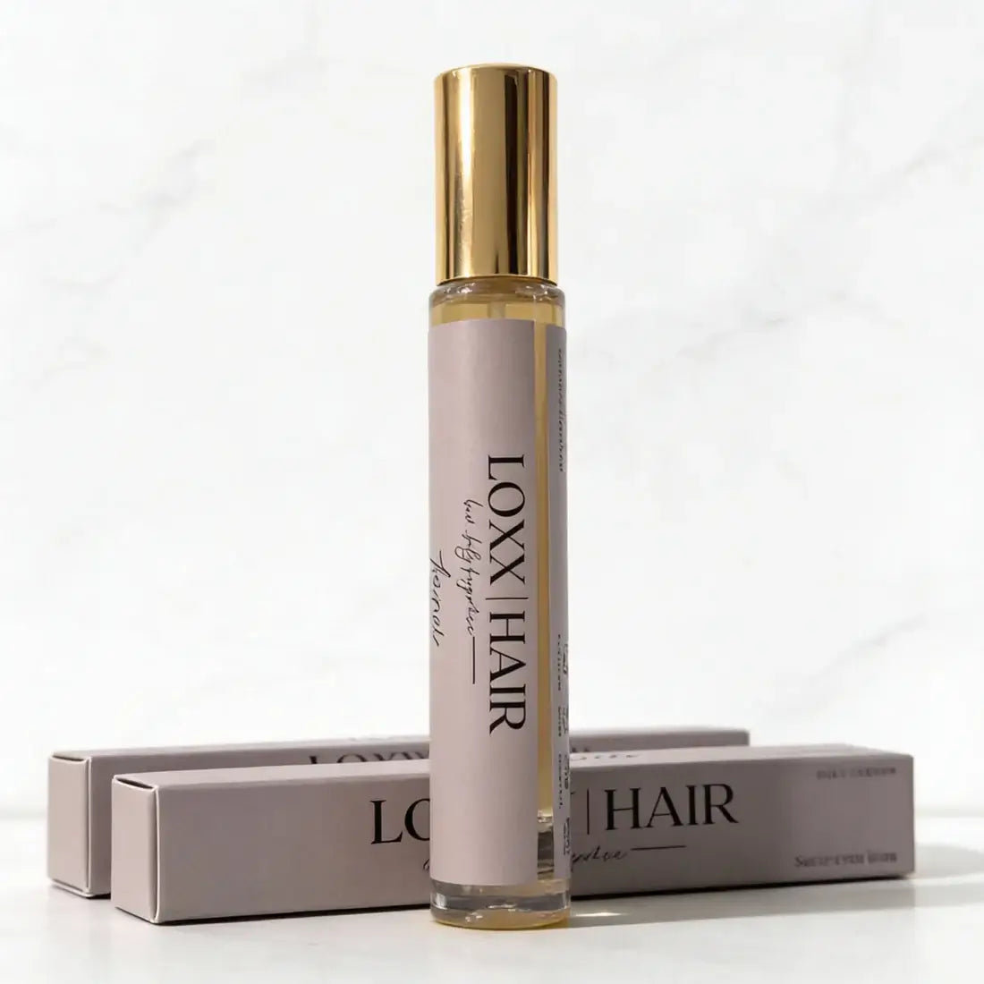 LOXX Toxxic Hair & Body Fragrance – 10mL travel size bottle with elegant packaging.