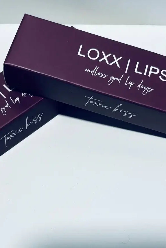 LOXX LIPS Peptide Lip Gloss Toxxic Kiss Berry Tint packaging on a clean background.