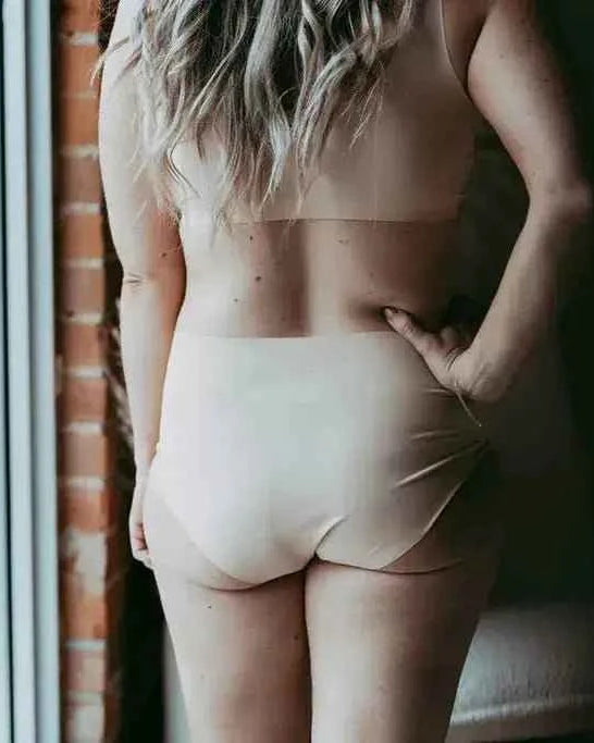 Katie Em Undies Ultimate Seamless Mid Rise Brief nude on model back view — Cloud Nine Pajamas Edmonton