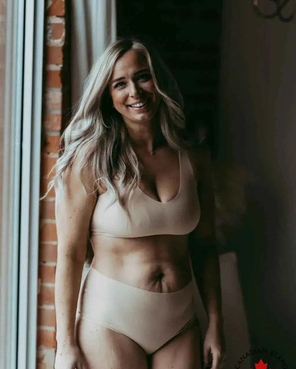 Katie Em Undies Ultimate Seamless Mid Rise Brief nude on model front view — Cloud Nine Pajamas Edmonton