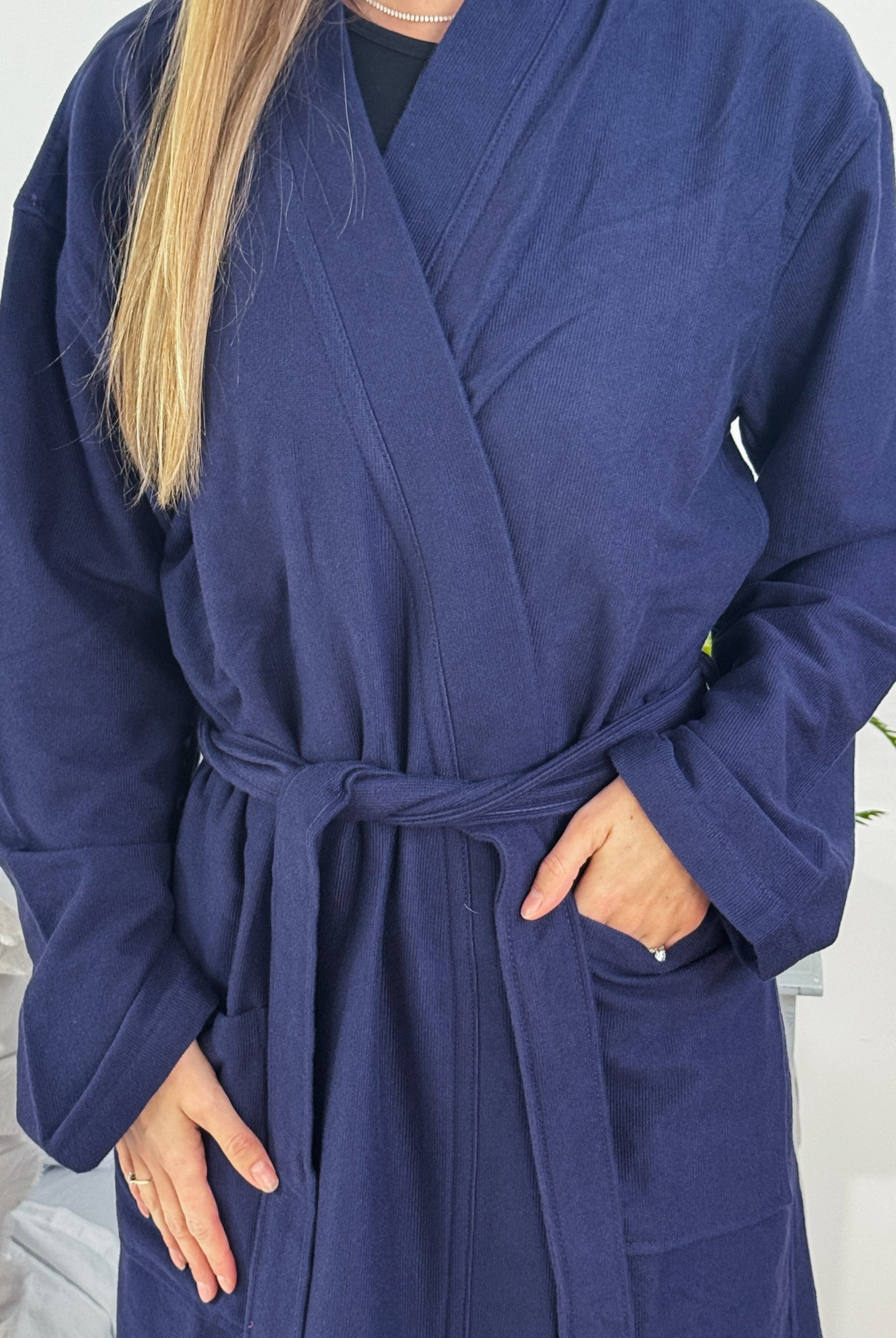 Unisex Cotton Terry robe in night blue, featuring a belt and pockets, perfect for relaxing at home.