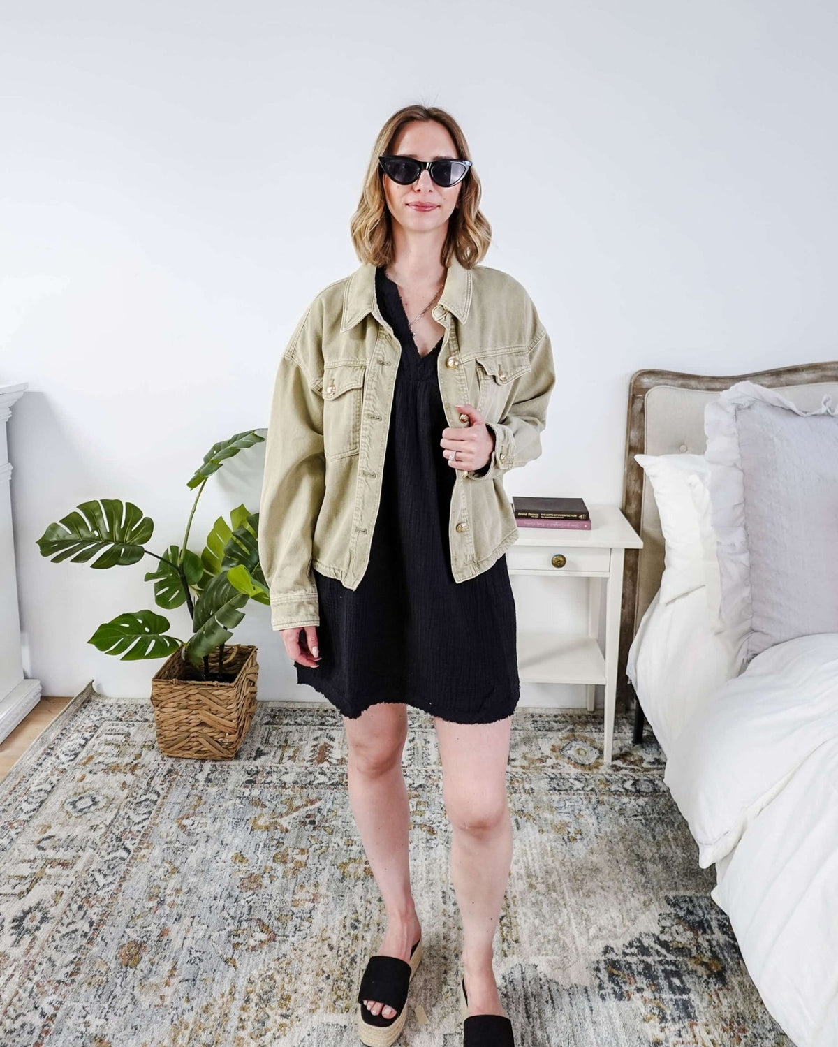 women in light weight gauze cotton black dress styled with a jean jacket. Scarlett Ellie V-Neck Gauze Dress | Lightweight Summer Dress | Cloud Nine Pajamas