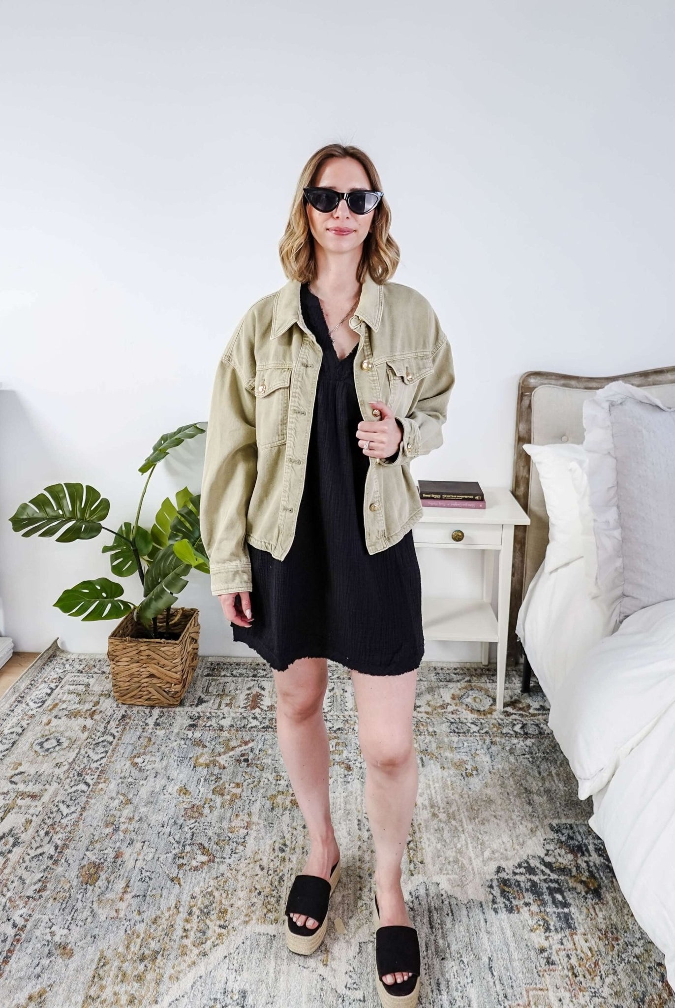 women in light weight gauze cotton black dress styled with a jean jacket. Scarlett Ellie V-Neck Gauze Dress | Lightweight Summer Dress | Cloud Nine Pajamas