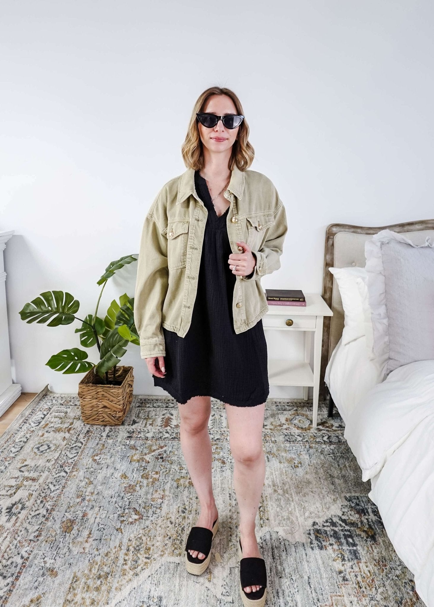 women in light weight gauze cotton black dress styled with a jean jacket. Scarlett Ellie V-Neck Gauze Dress | Lightweight Summer Dress | Cloud Nine Pajamas
