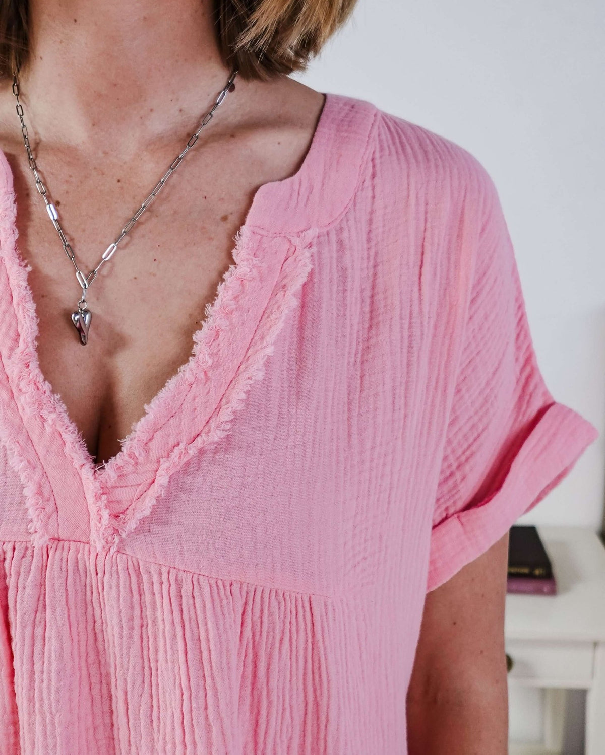 women in light weight gauze cotton pink dress Scarlett Ellie V-Neck Gauze Dress | Lightweight Summer Dress | Cloud Nine Pajamas close up showing texture of the cotton gauze