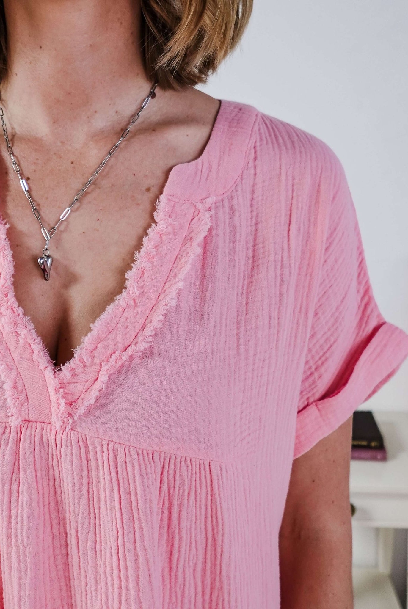 women in light weight gauze cotton pink dress Scarlett Ellie V-Neck Gauze Dress | Lightweight Summer Dress | Cloud Nine Pajamas close up showing texture of the cotton gauze