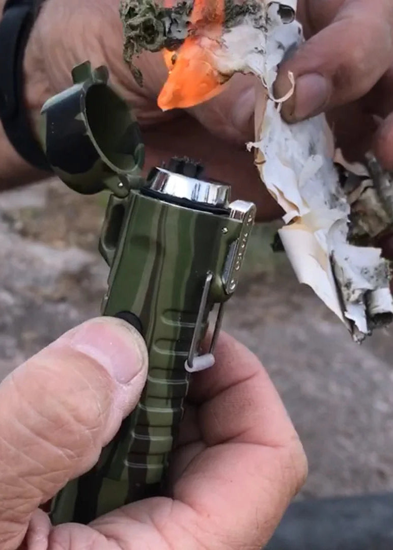 Sizzle Survival USB Rechargeable Electric Plasma Lighter & Flashlight shown lighting paper on fire. Photo shows the lighter in green. Cloud Nine Pajamas Edmonton