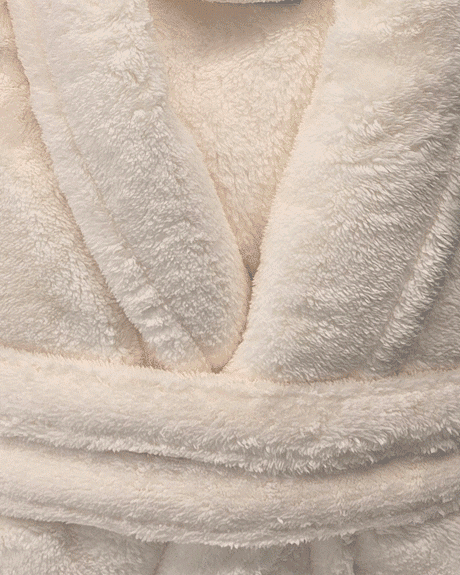 warm buddy plush robes folded showing texture cream robe