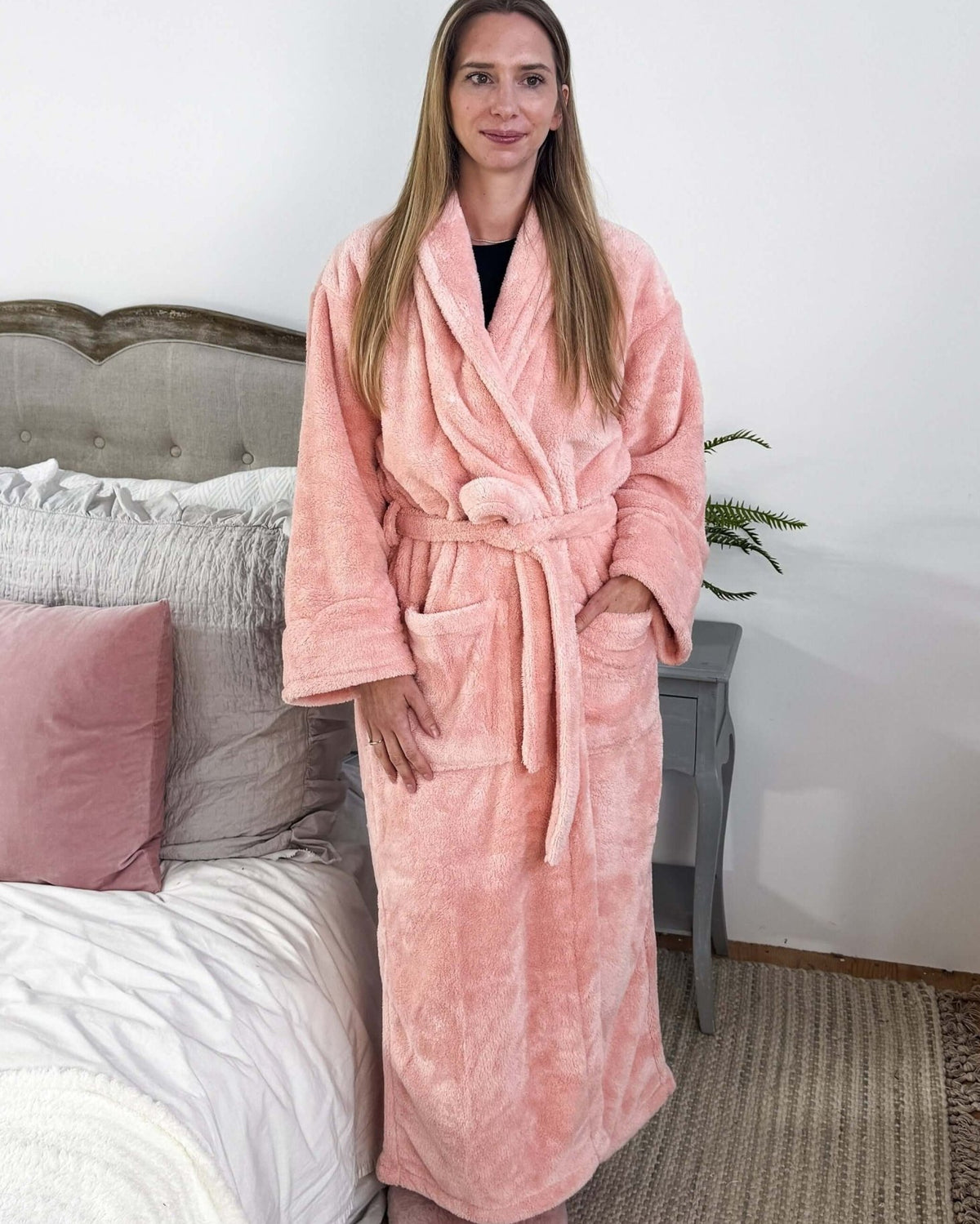 WARM BUDDY - Cozy Ultra Plush Spa Robe in Pink, Shown on a women on a bedroom setting showing full length on model who is 5'8"