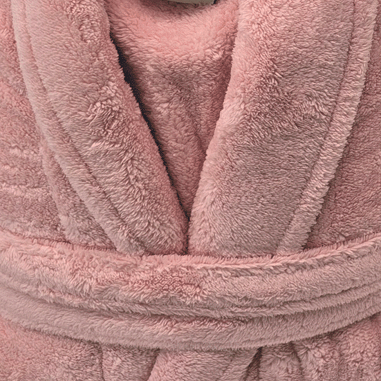Close-up of a pink plush robe with texture details from warm buddy