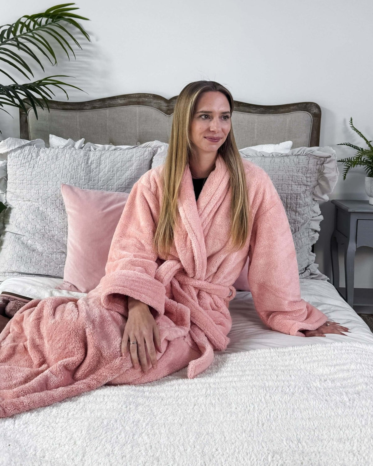 WARM BUDDY - Cozy Ultra Plush Spa Robe in Pink, Shown on a women on a bedroom setting